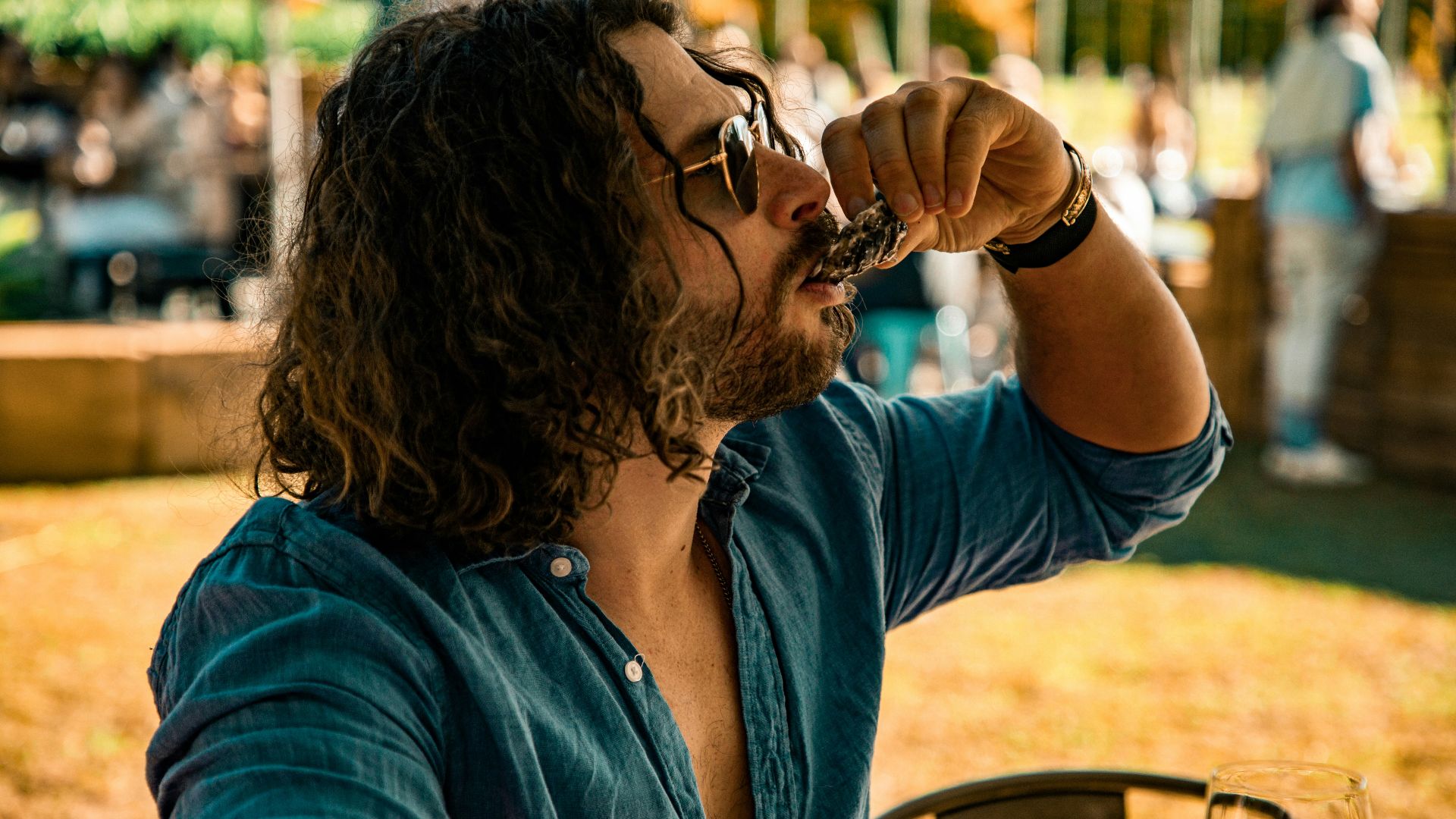 woman in blue denim jacket sitting on chair