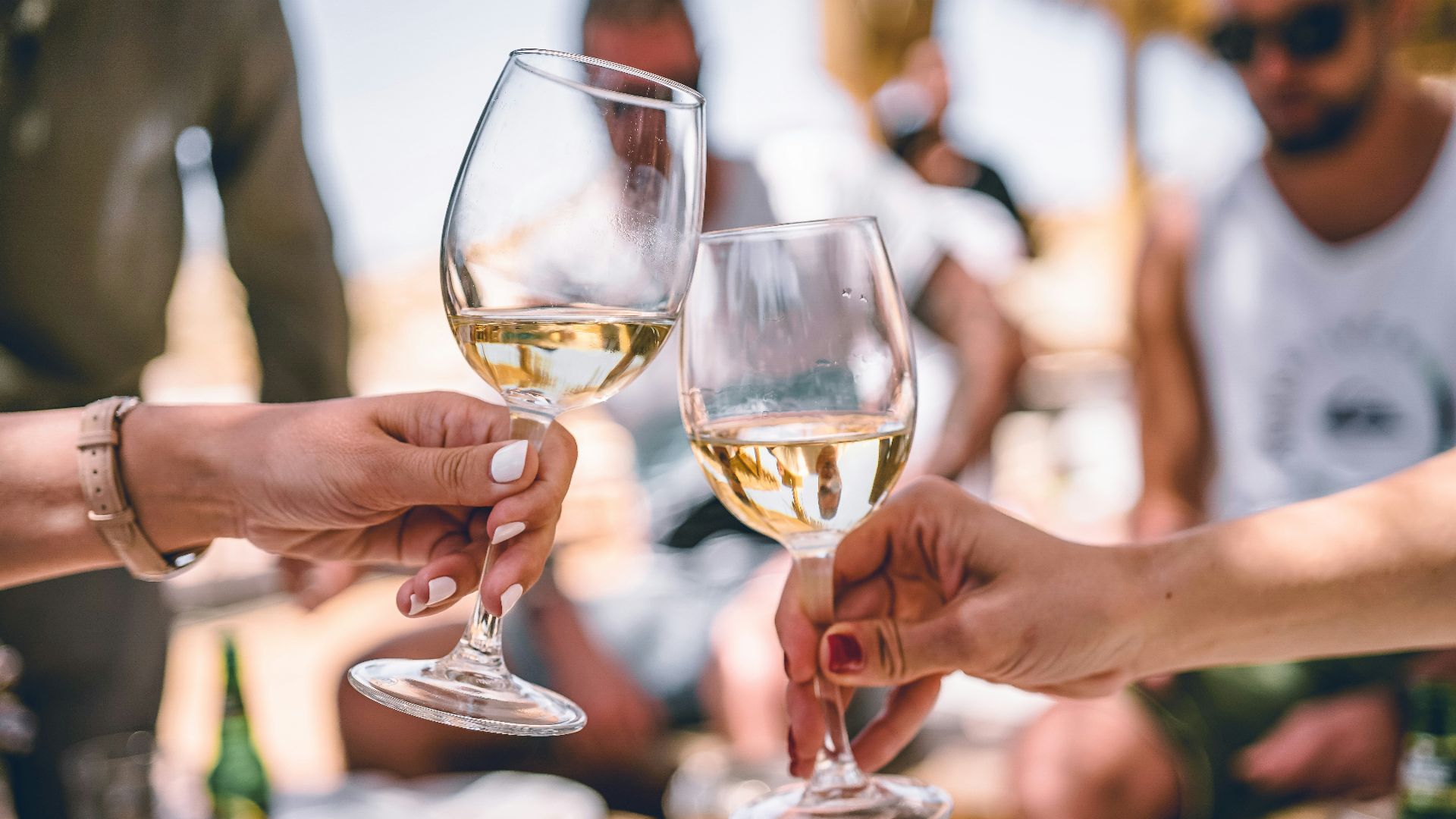two women holding glass of champagnes