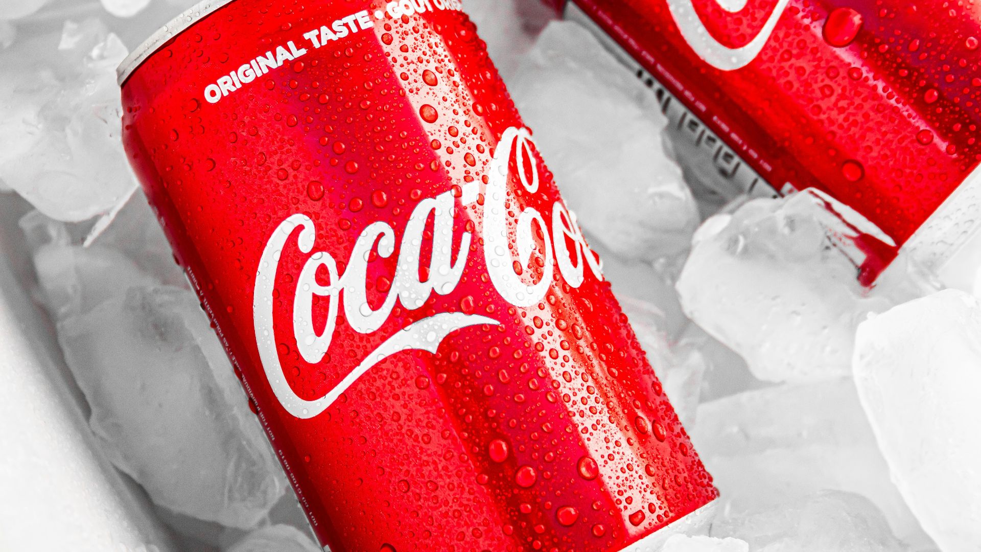 coca cola can on white plastic pack