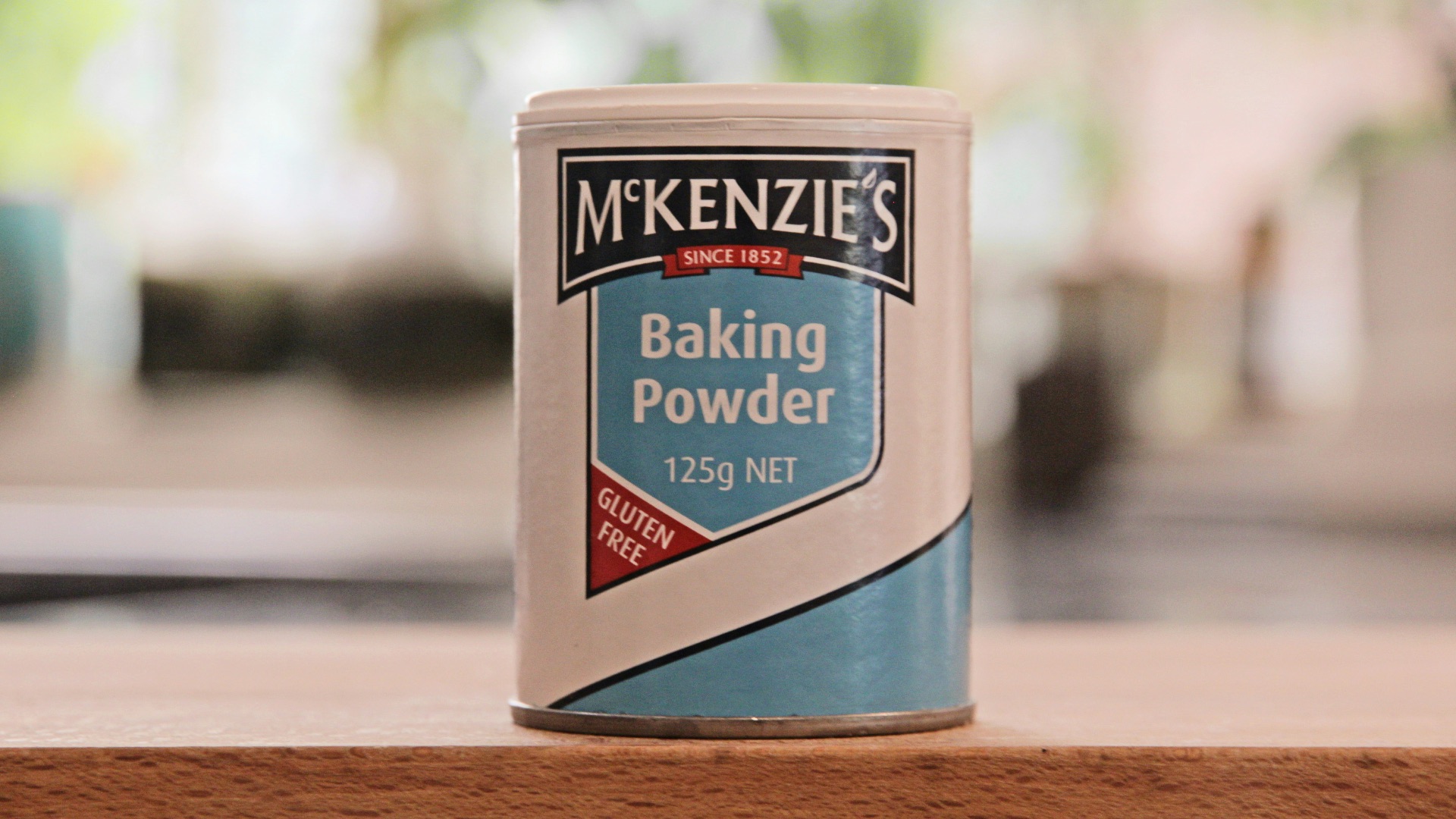 a can of baking powder sitting on a table