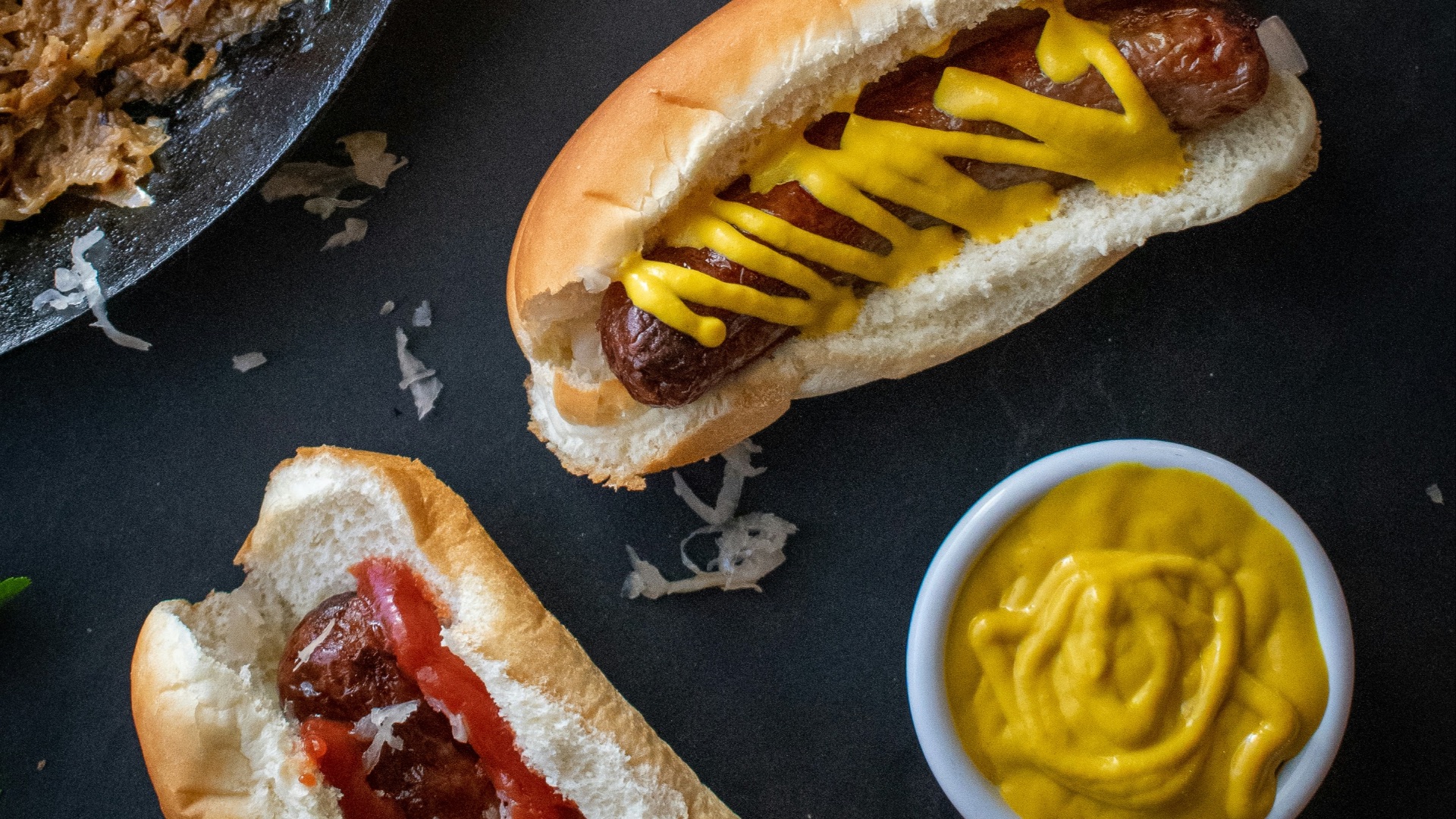 a couple of hot dogs sitting on top of a table