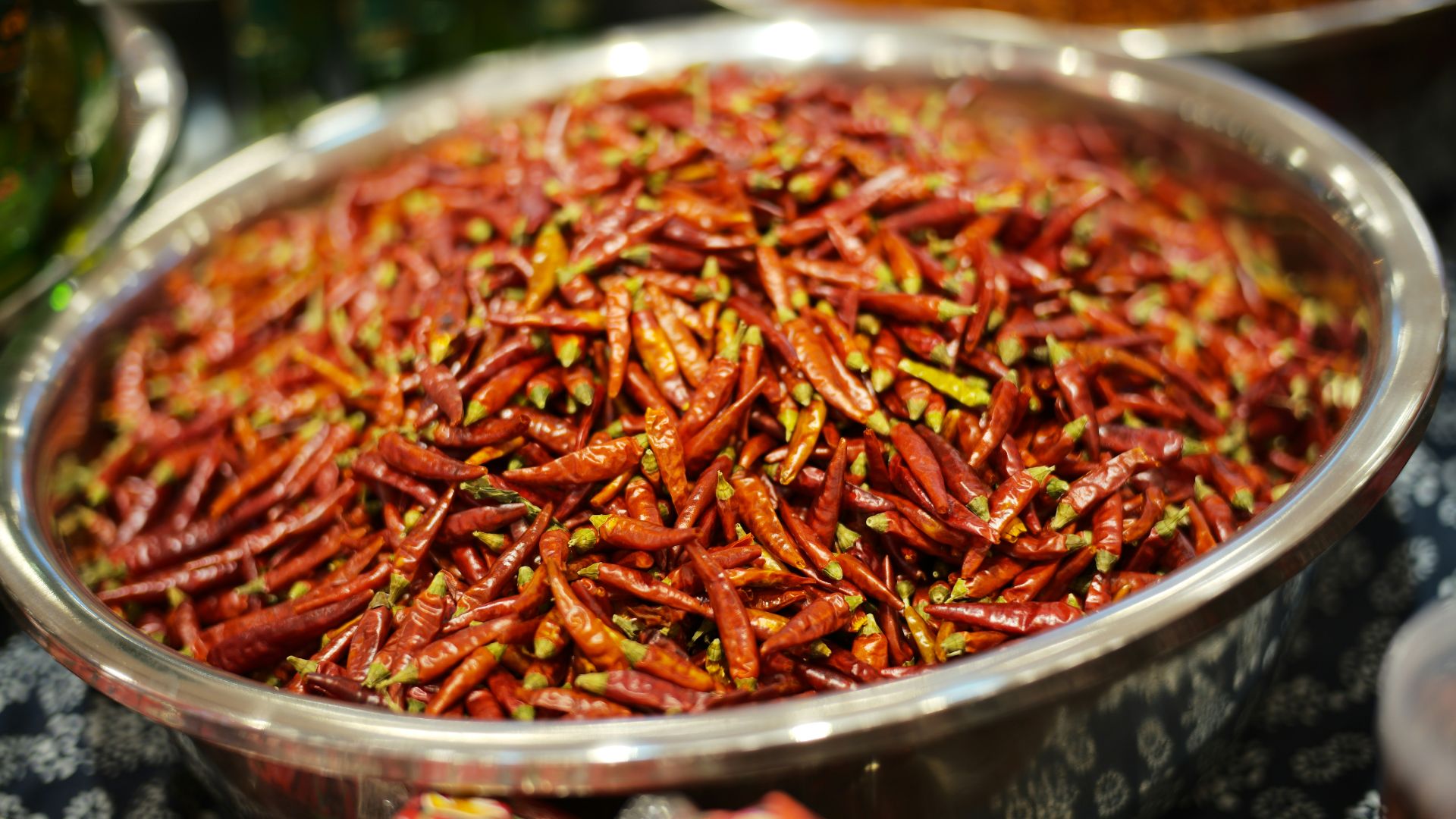 A large bowl filled with dried red chili peppers.