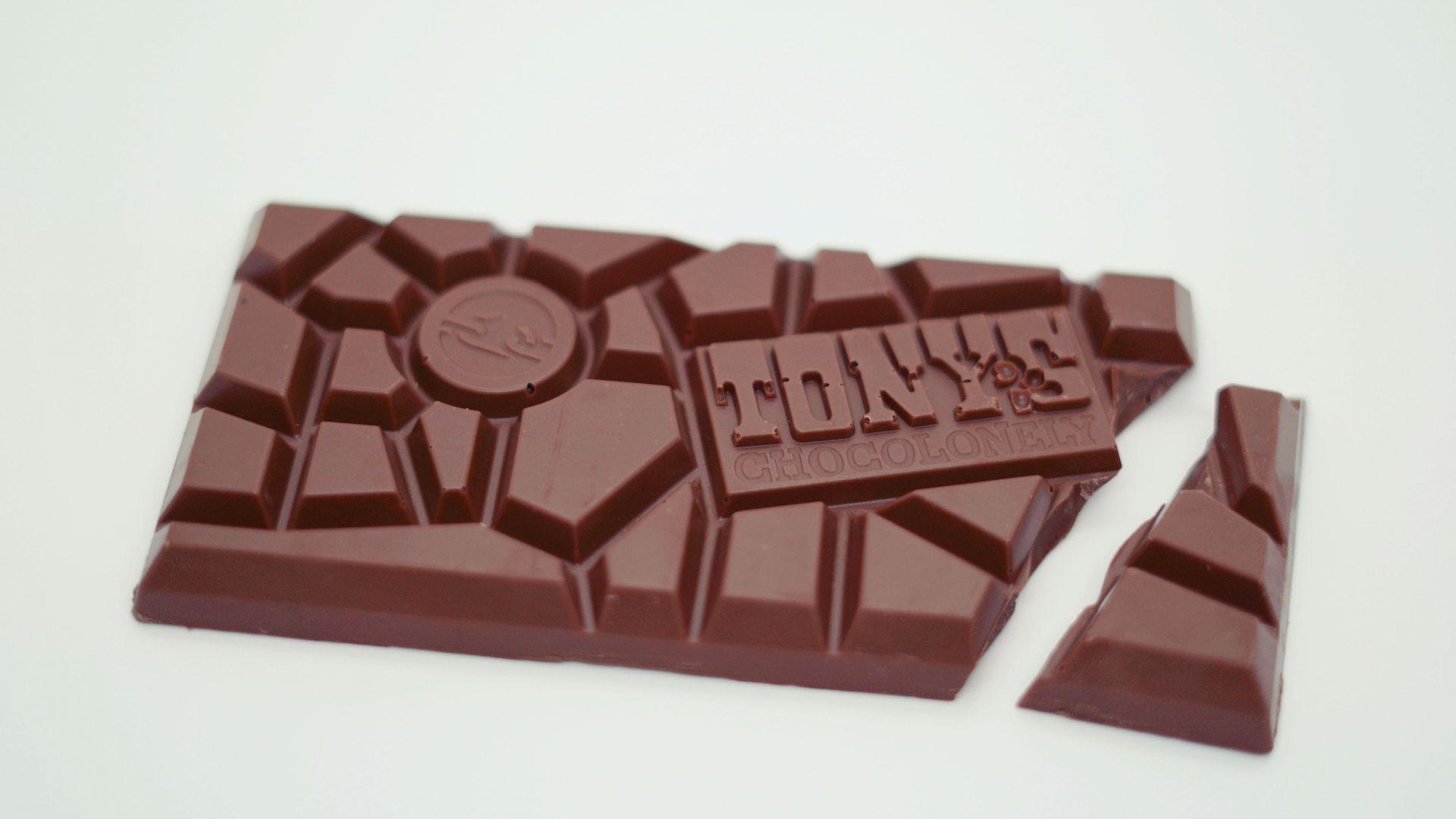 two pieces of chocolate sitting on top of each other