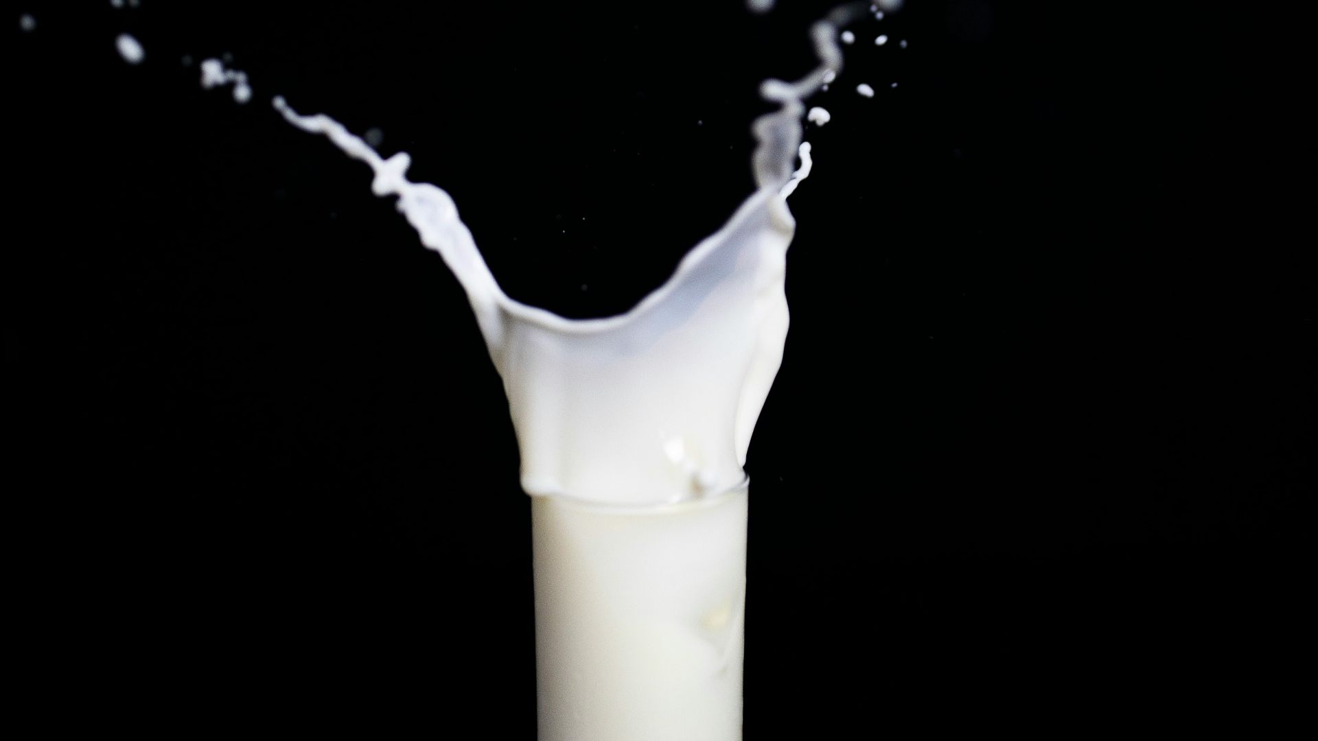 white candle in black holder