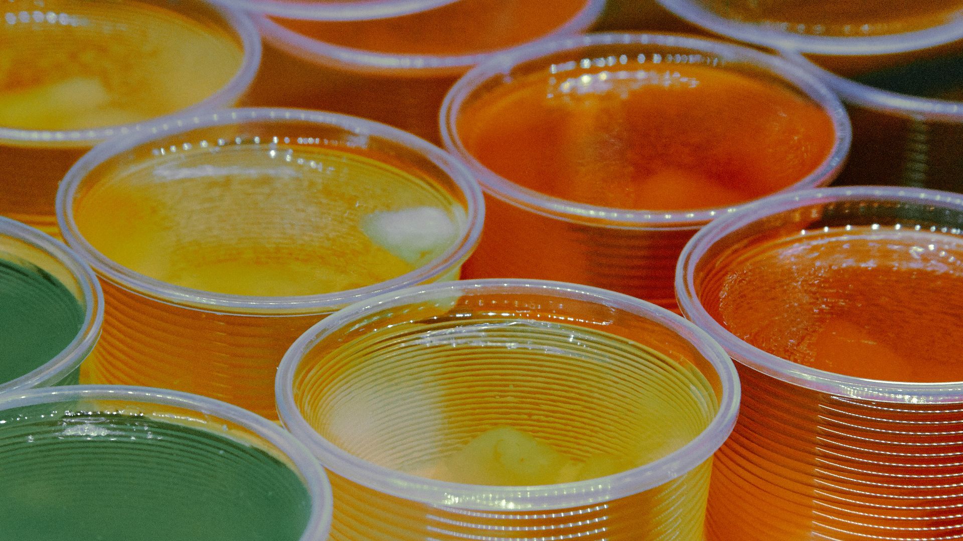 clear glass jars with yellow liquid