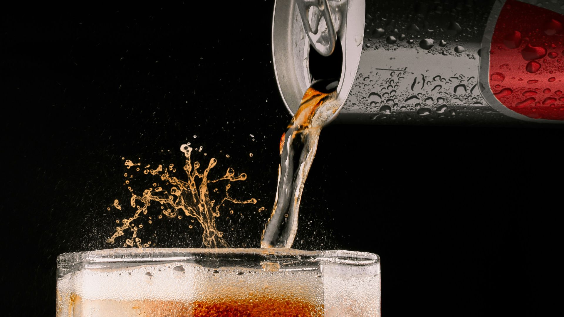 clear drinking glass with brown liquid