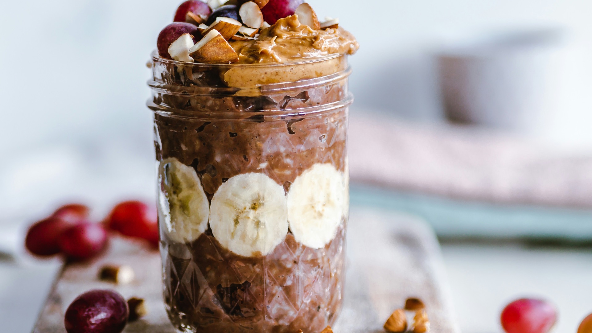 fruits and cream in clear glass cup
