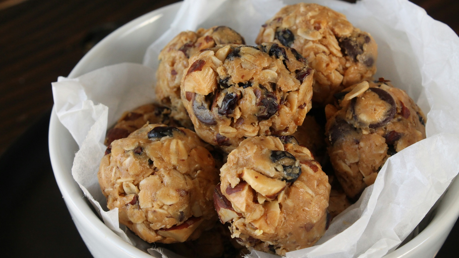 a white bowl filled with oatmeal and raisins