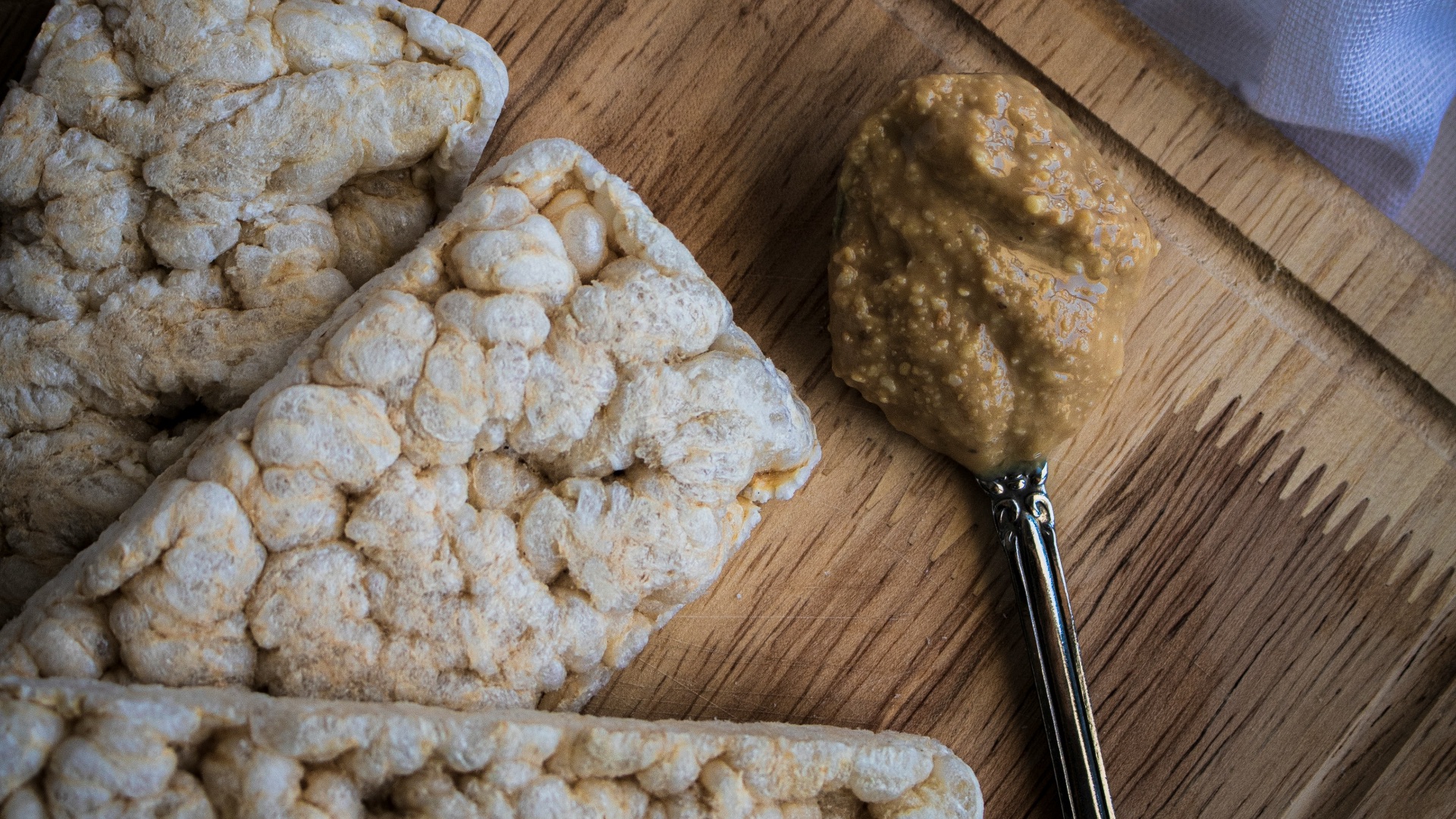 a wooden cutting board topped with food next to a knife