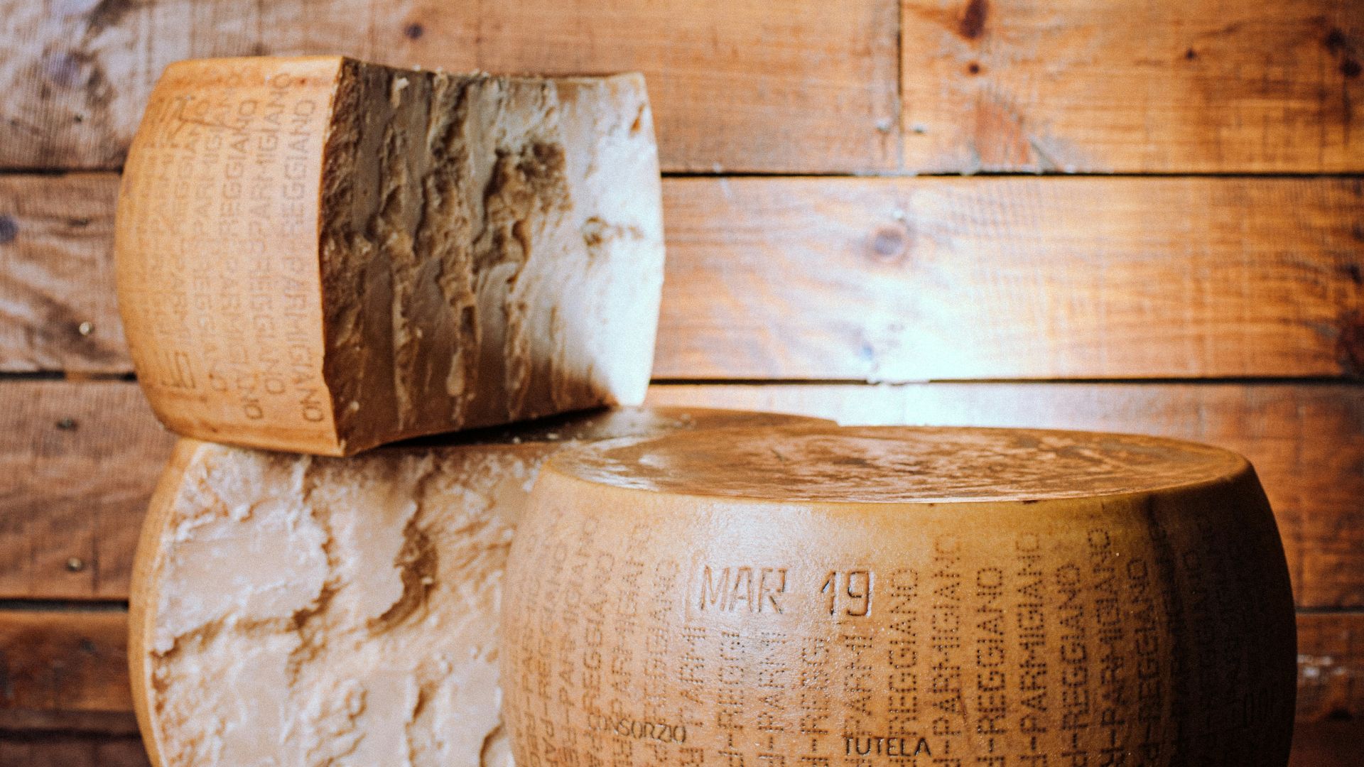a couple of large pieces of cheese sitting on top of a table