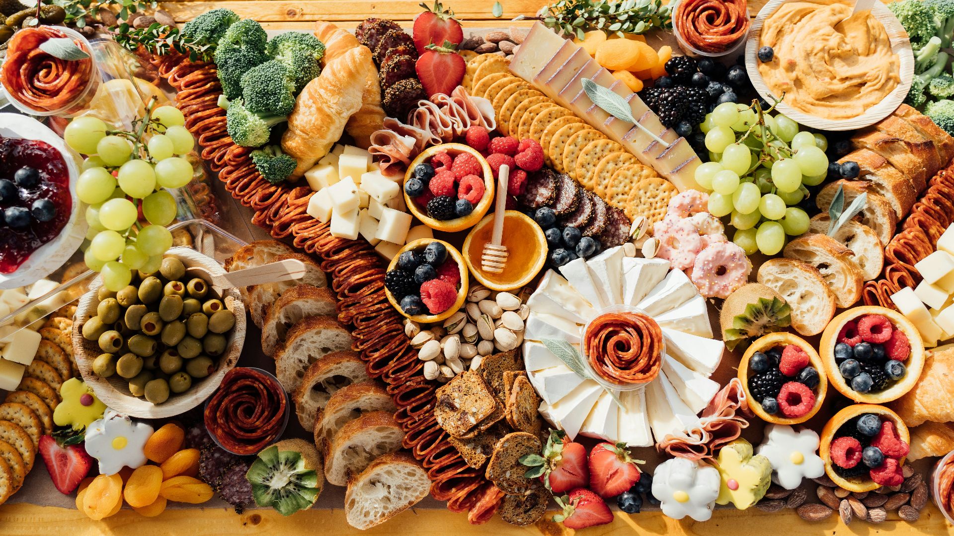 a wooden table topped with lots of different types of food