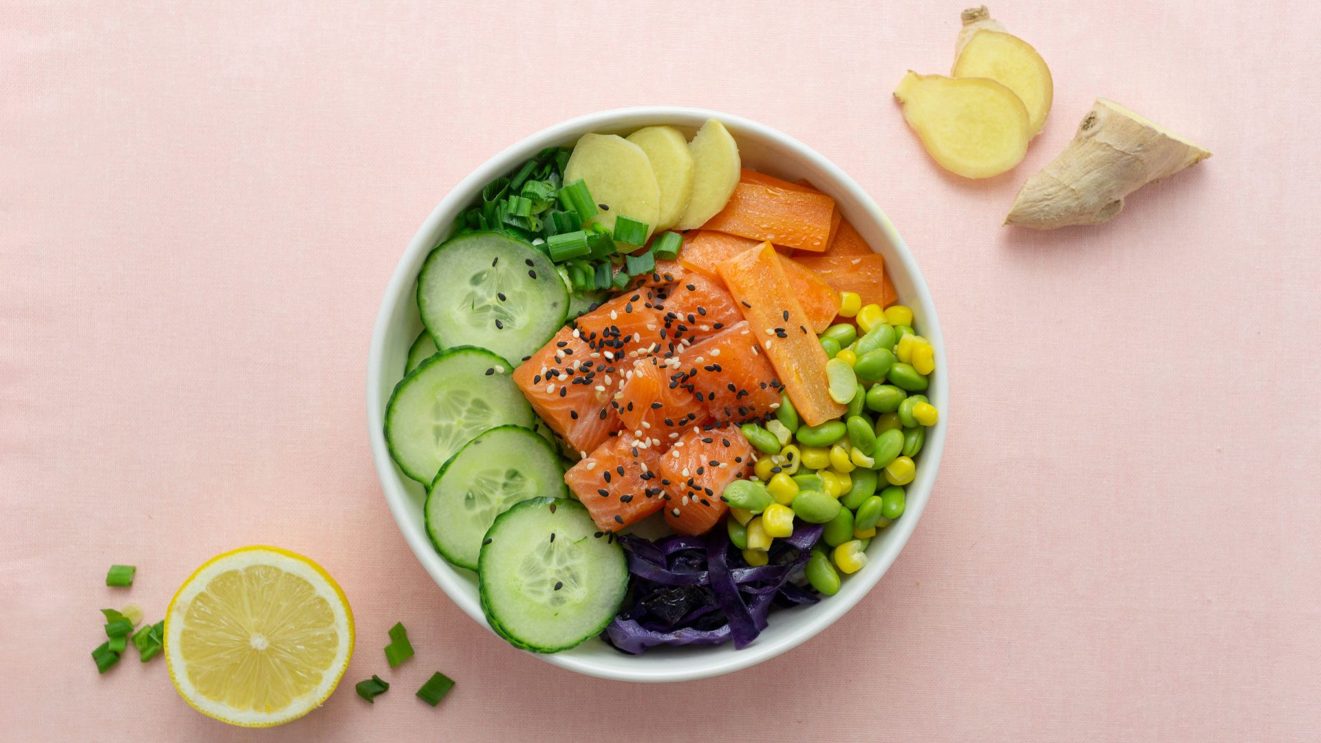 sliced cucumber and sliced lemon on white ceramic bowl