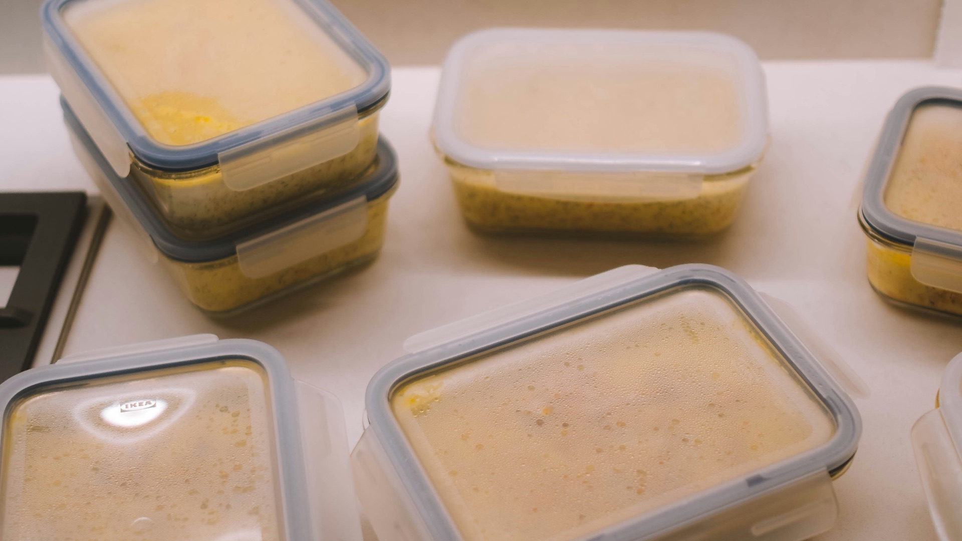 white plastic food container on white table