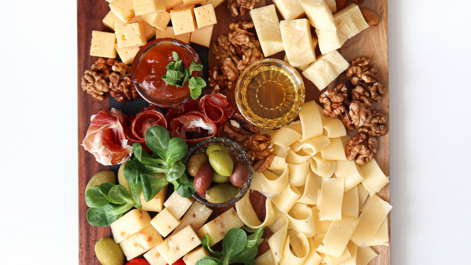 sliced vegetables on brown wooden chopping board