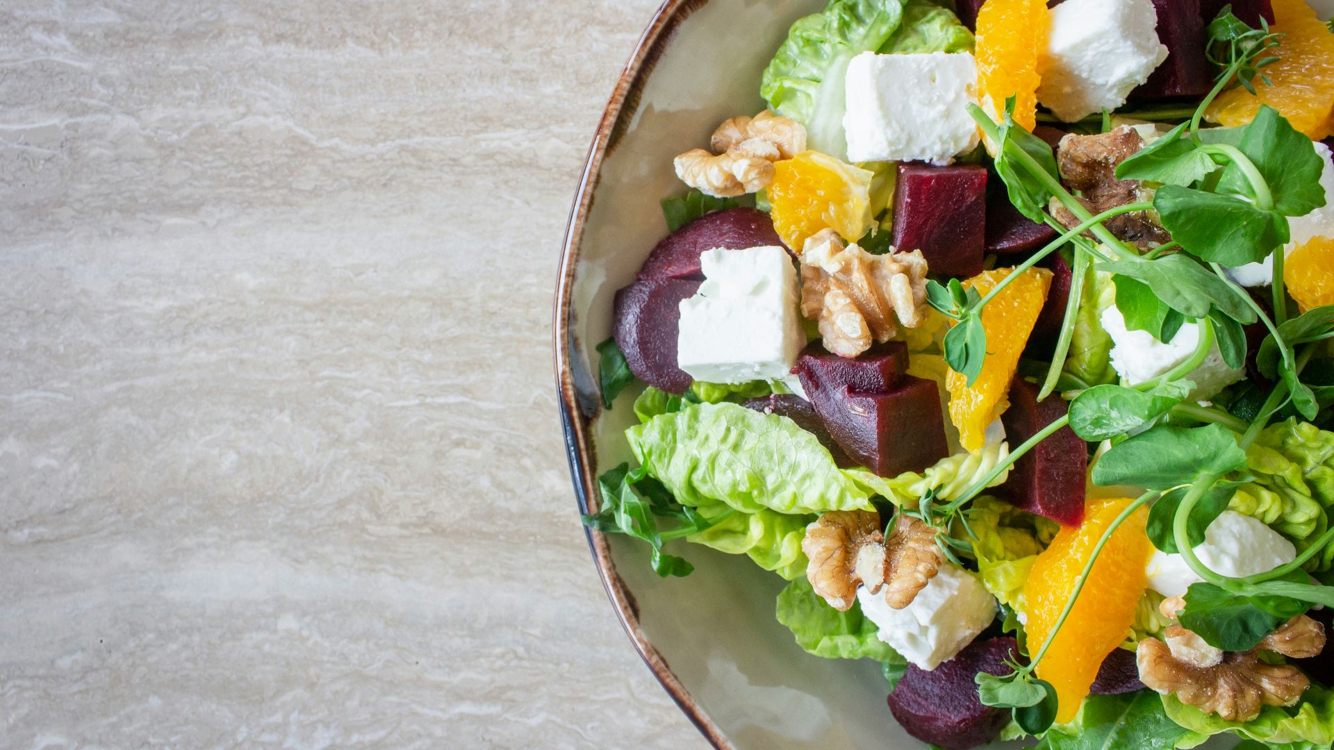 bowl of vegetable salad with walnuts