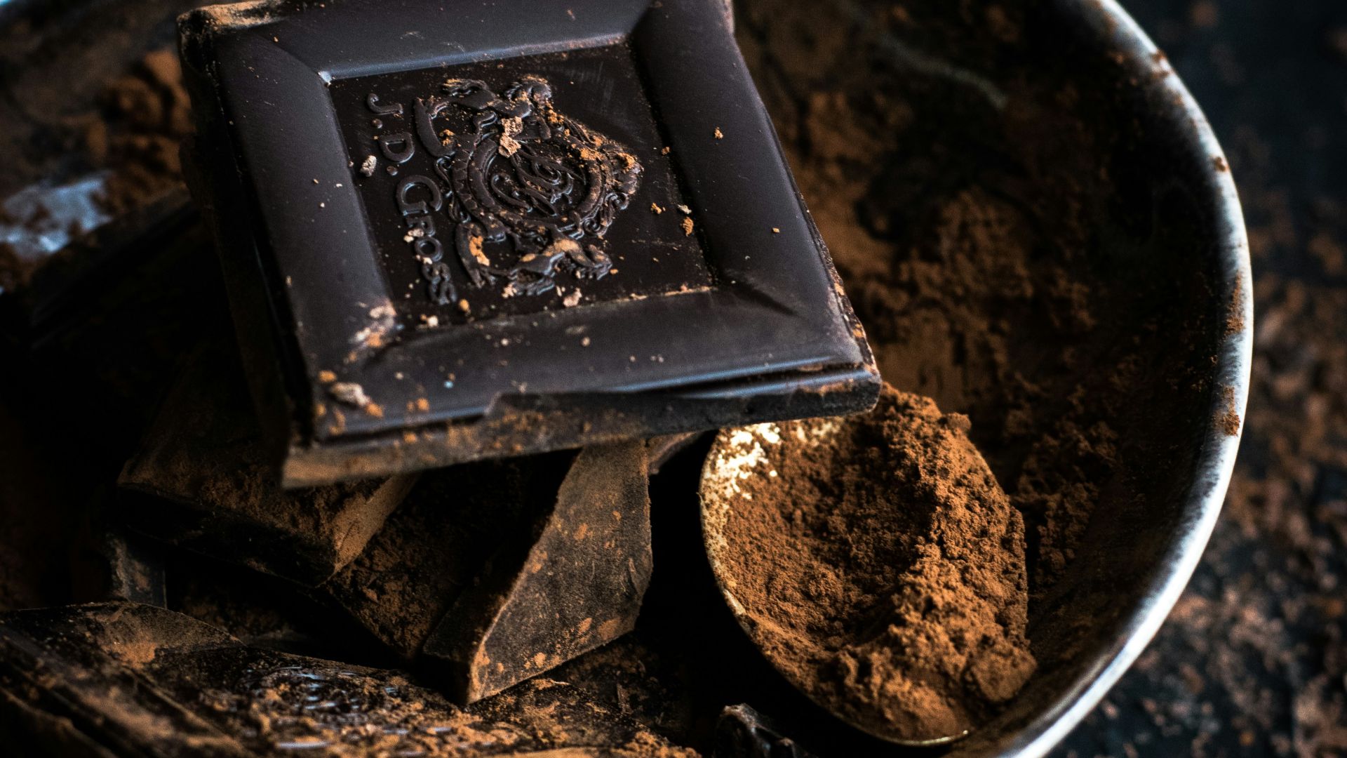 chocolate bar and powder in bowl