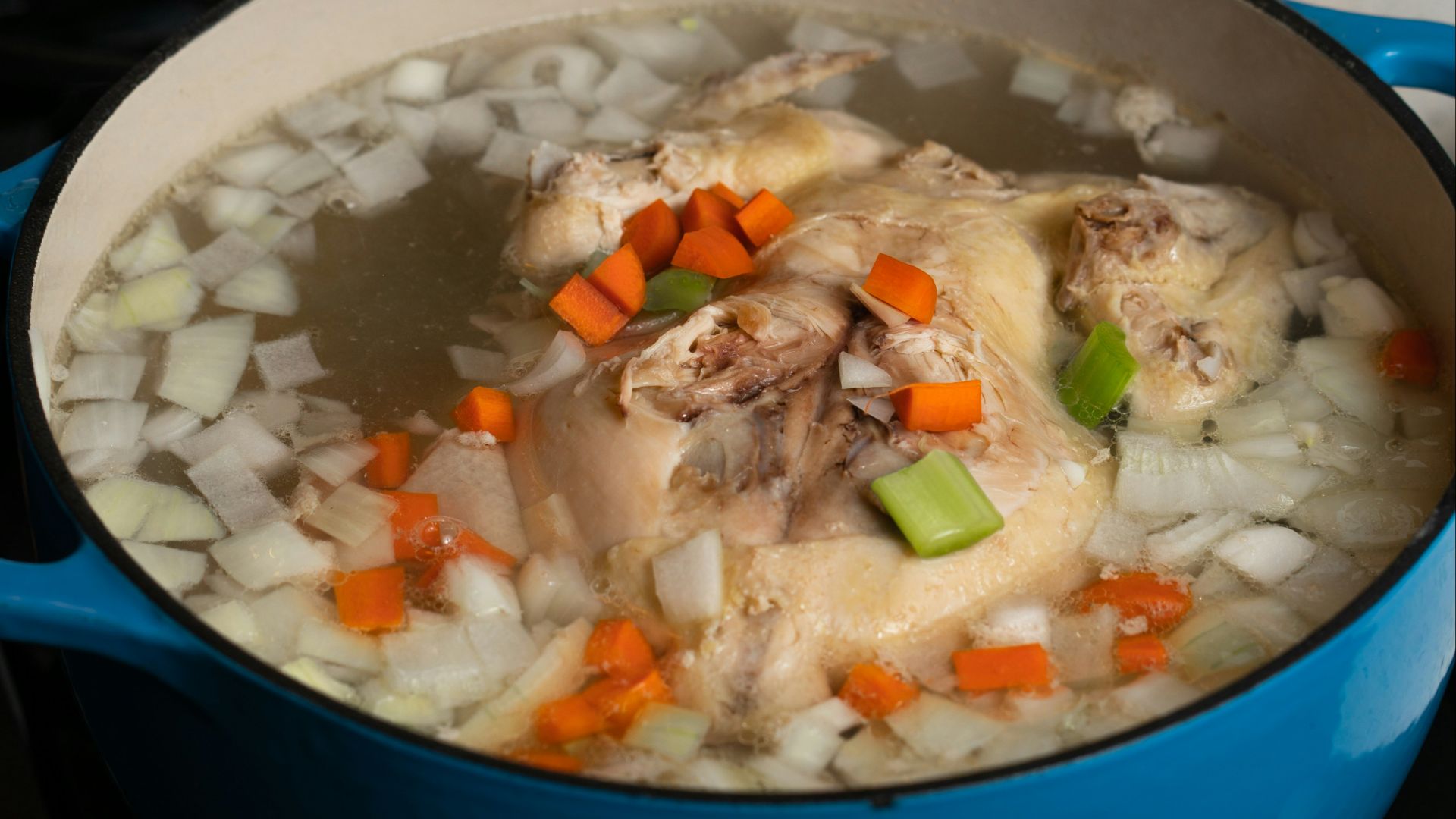 white rice with green peas and carrots in blue ceramic bowl