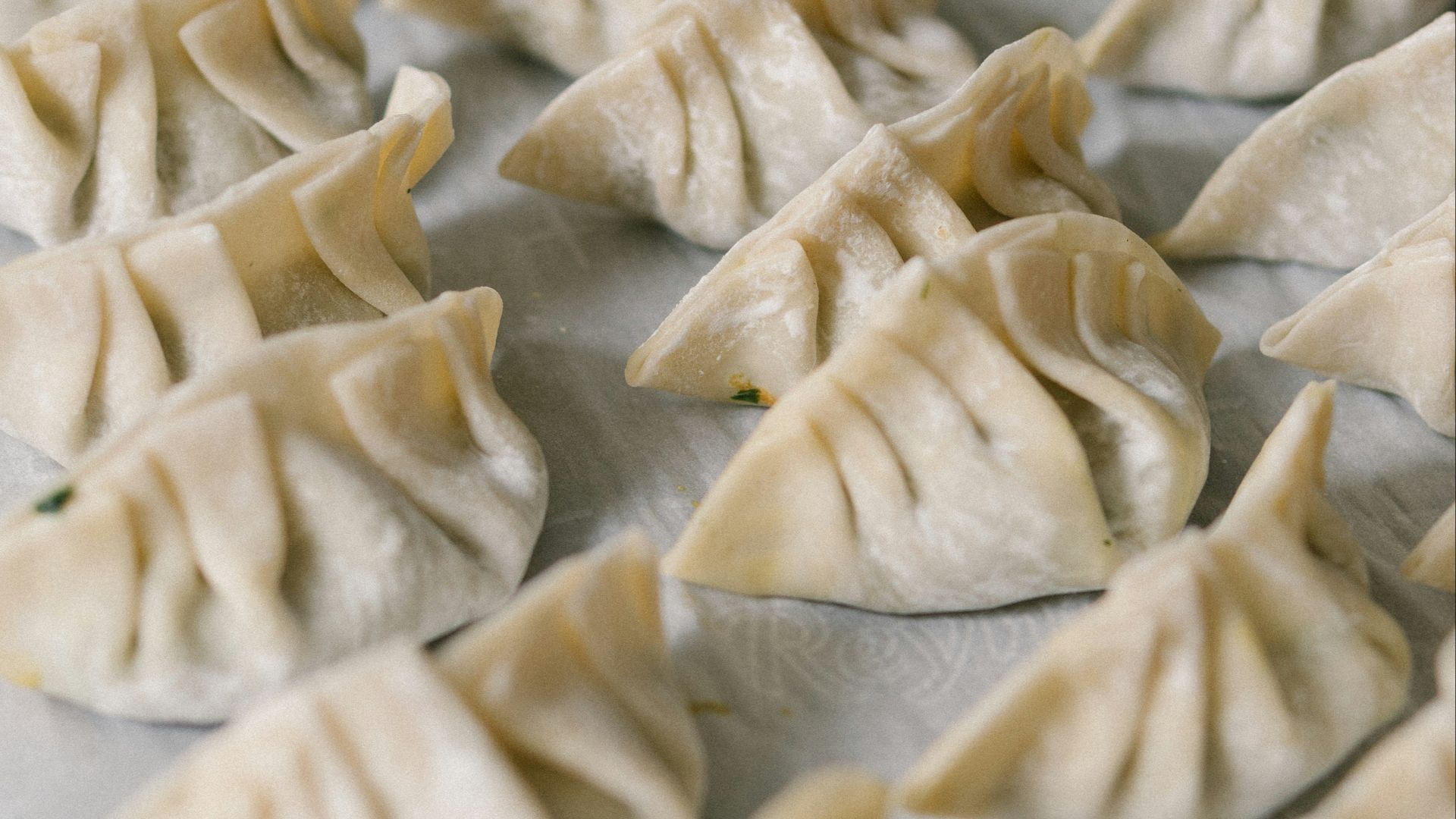 white textile on brown wooden table