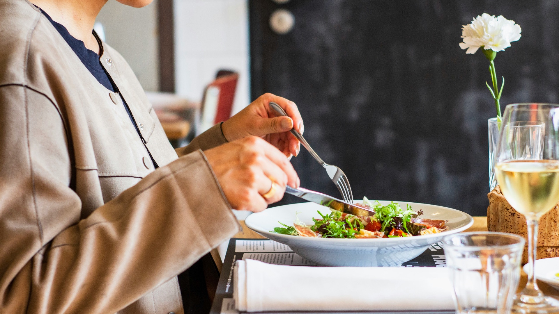 person eating vegetable salad