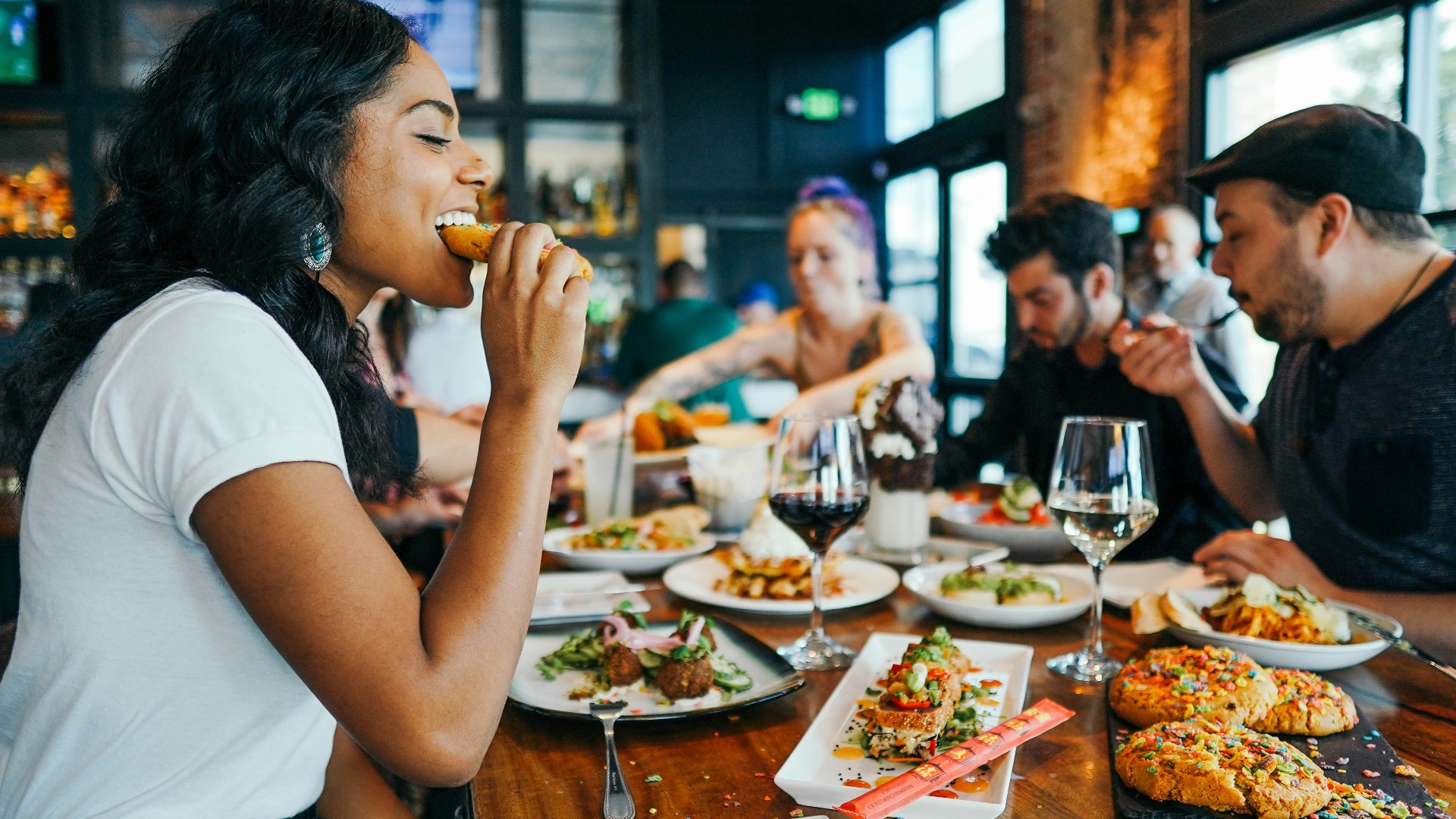 woman in white shirt eating