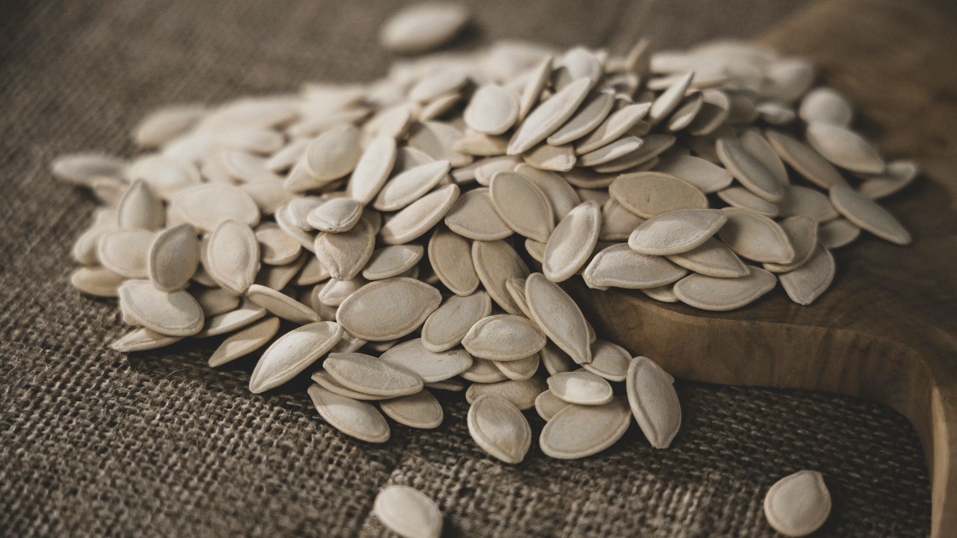 brown seeds on brown wooden surface