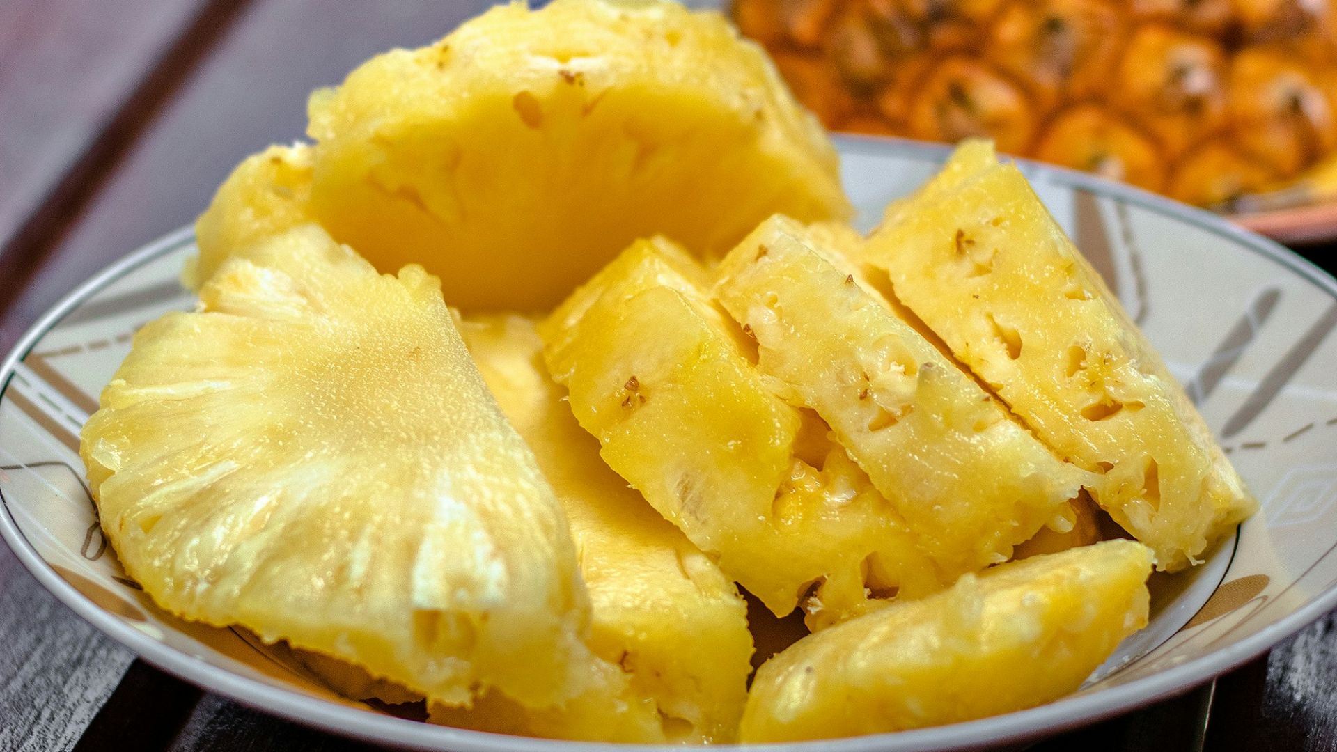 sliced pineapple on white ceramic plate