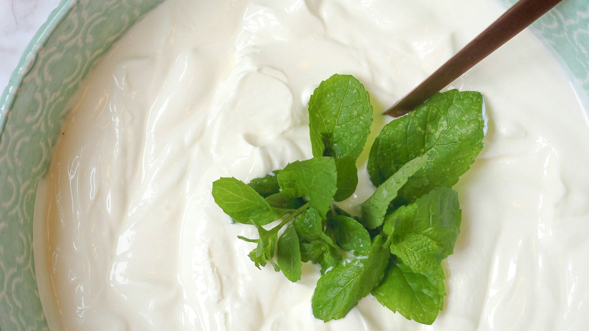 a bowl of yogurt with a spoon in it