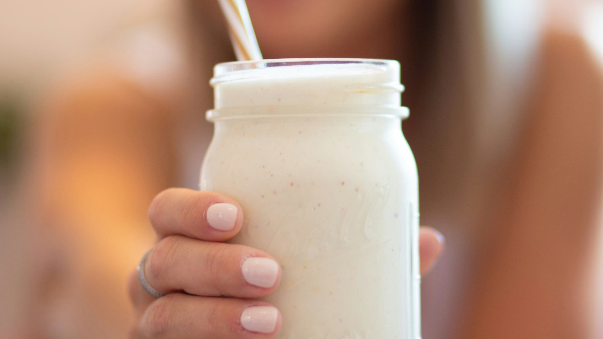 woman holding glass jar