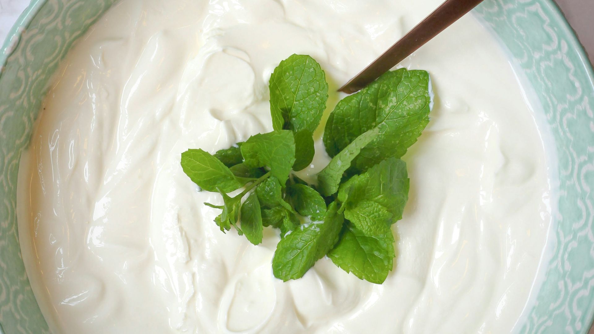 a bowl of yogurt with a spoon in it