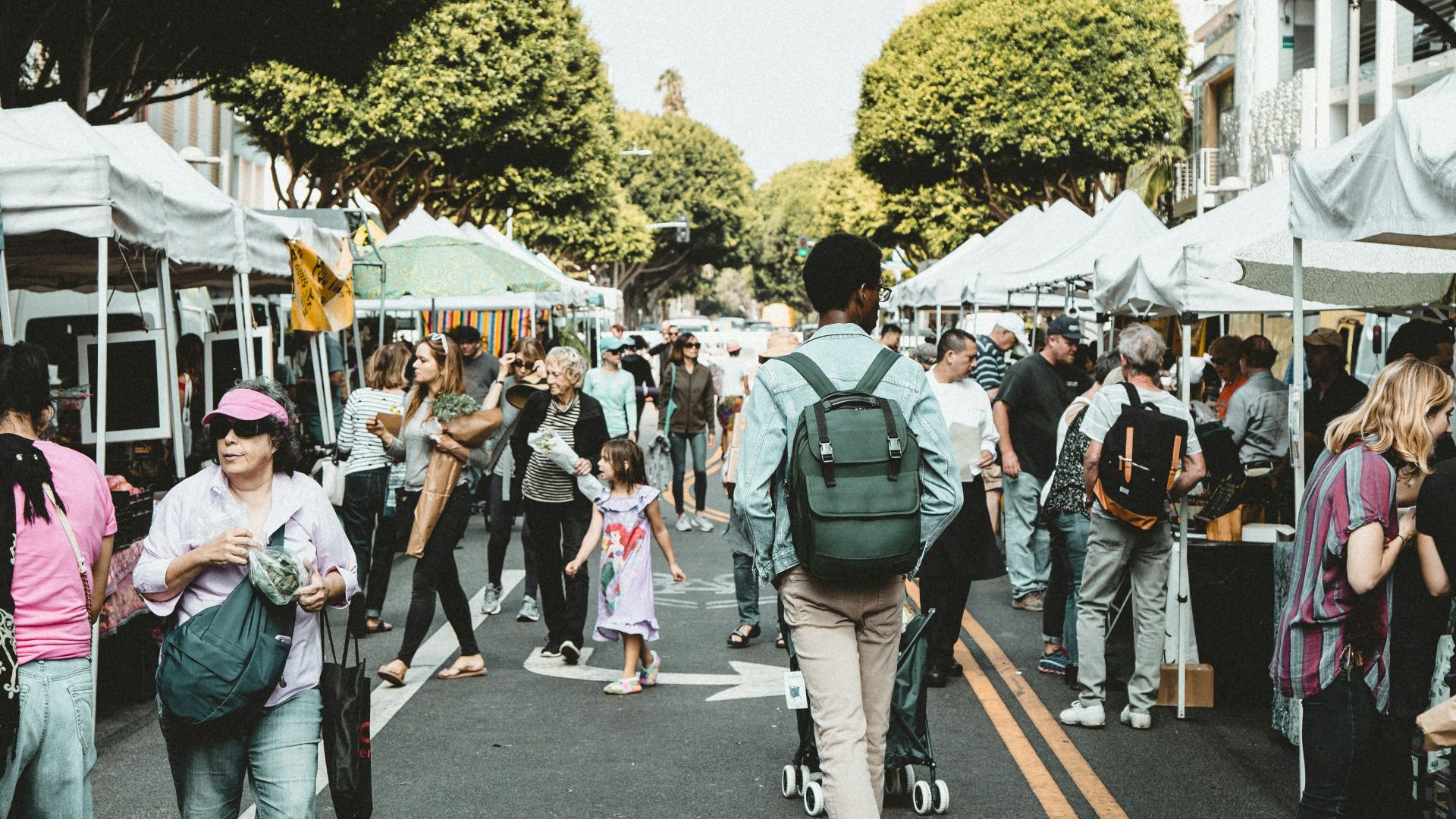 people walking on walkway during daytime