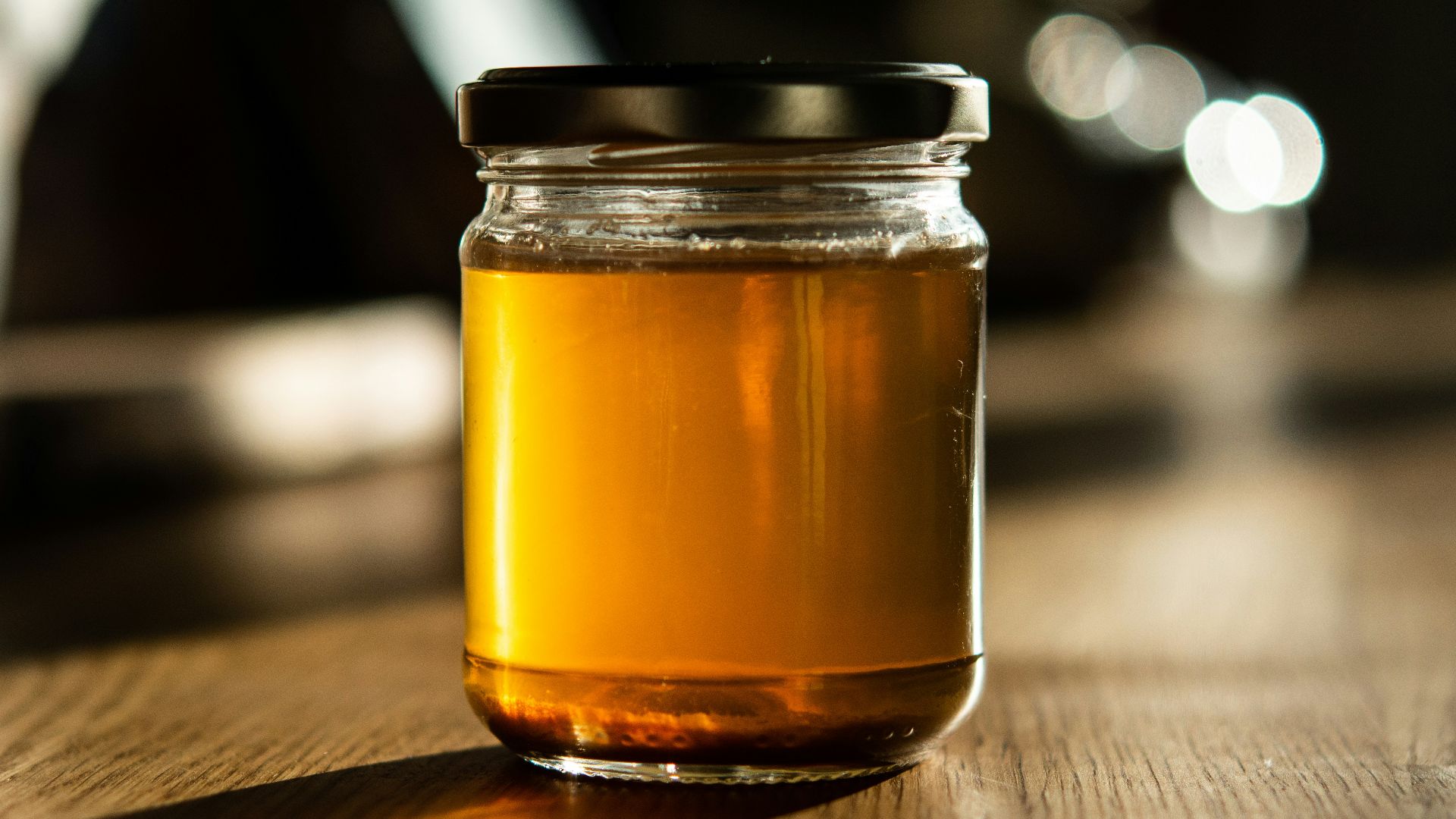 clear glass jar with brown liquid inside