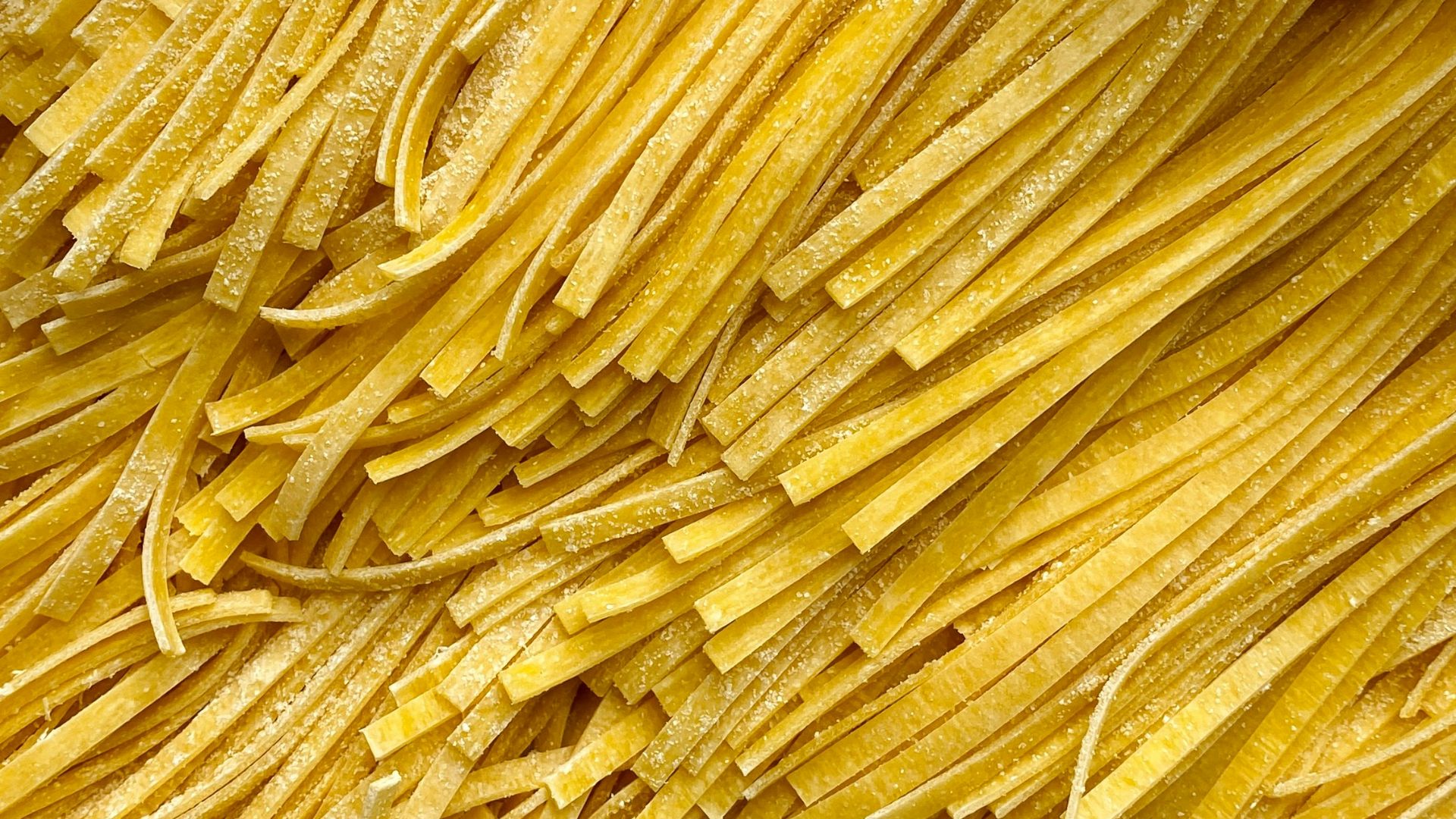 a box filled with lots of yellow noodles