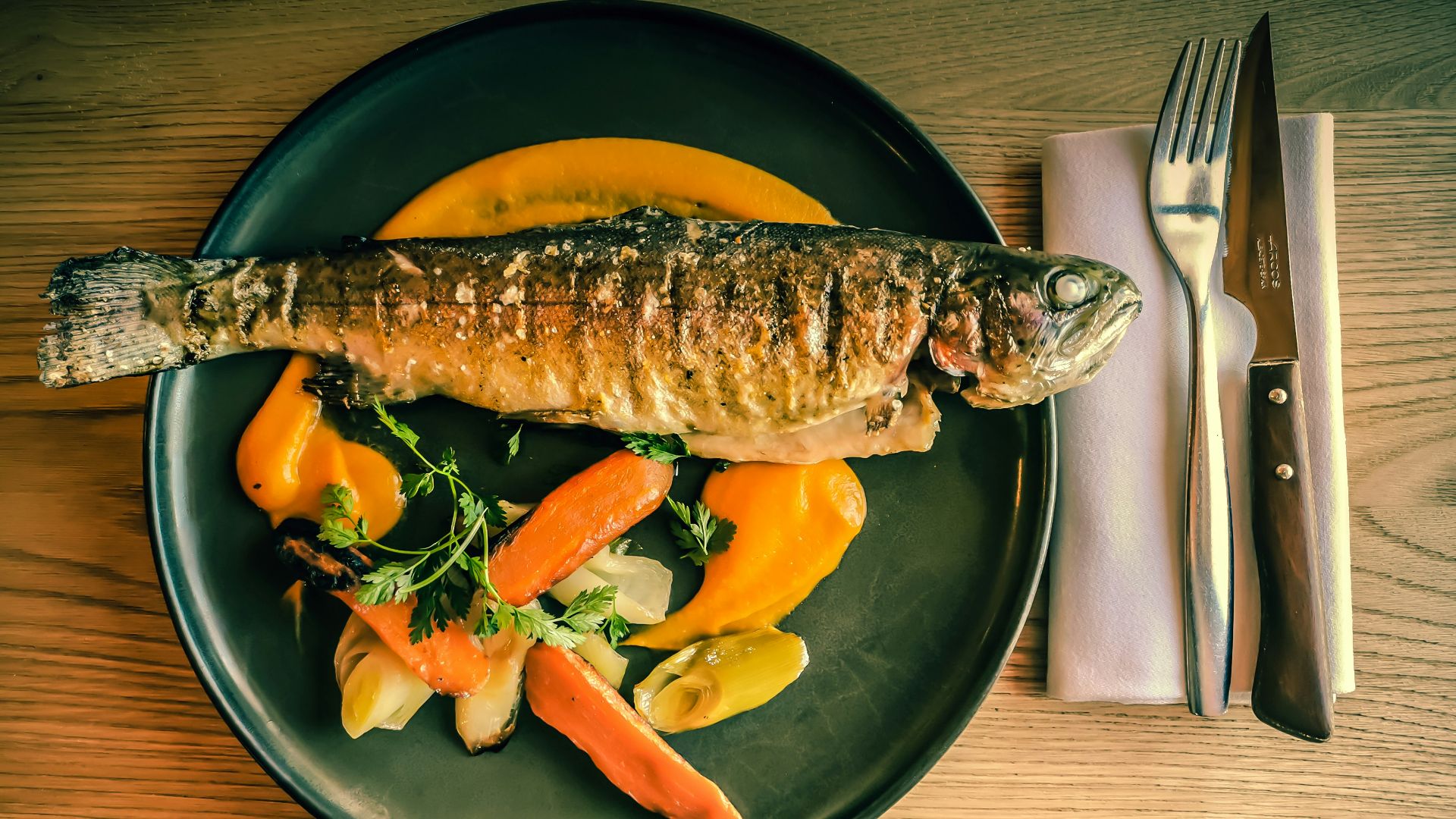 fish dish on blue ceramic plate