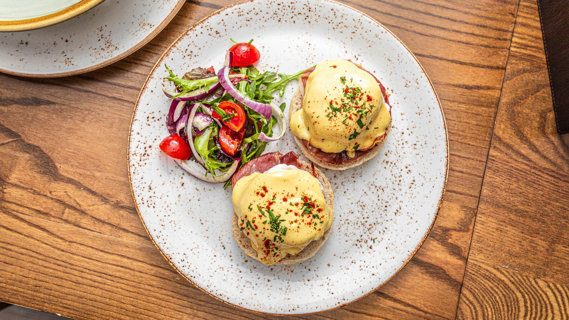 a plate of food on a wooden table