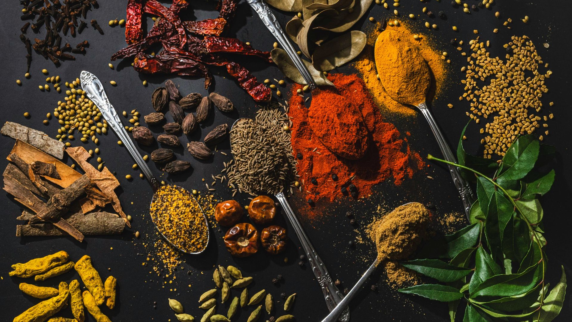 a table topped with different types of spices