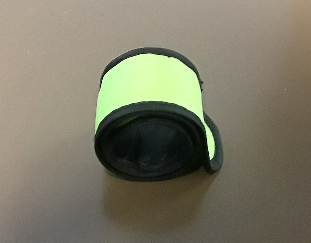 Neon Green Slap Bracelet Rolled Up And Seen From Overhead
