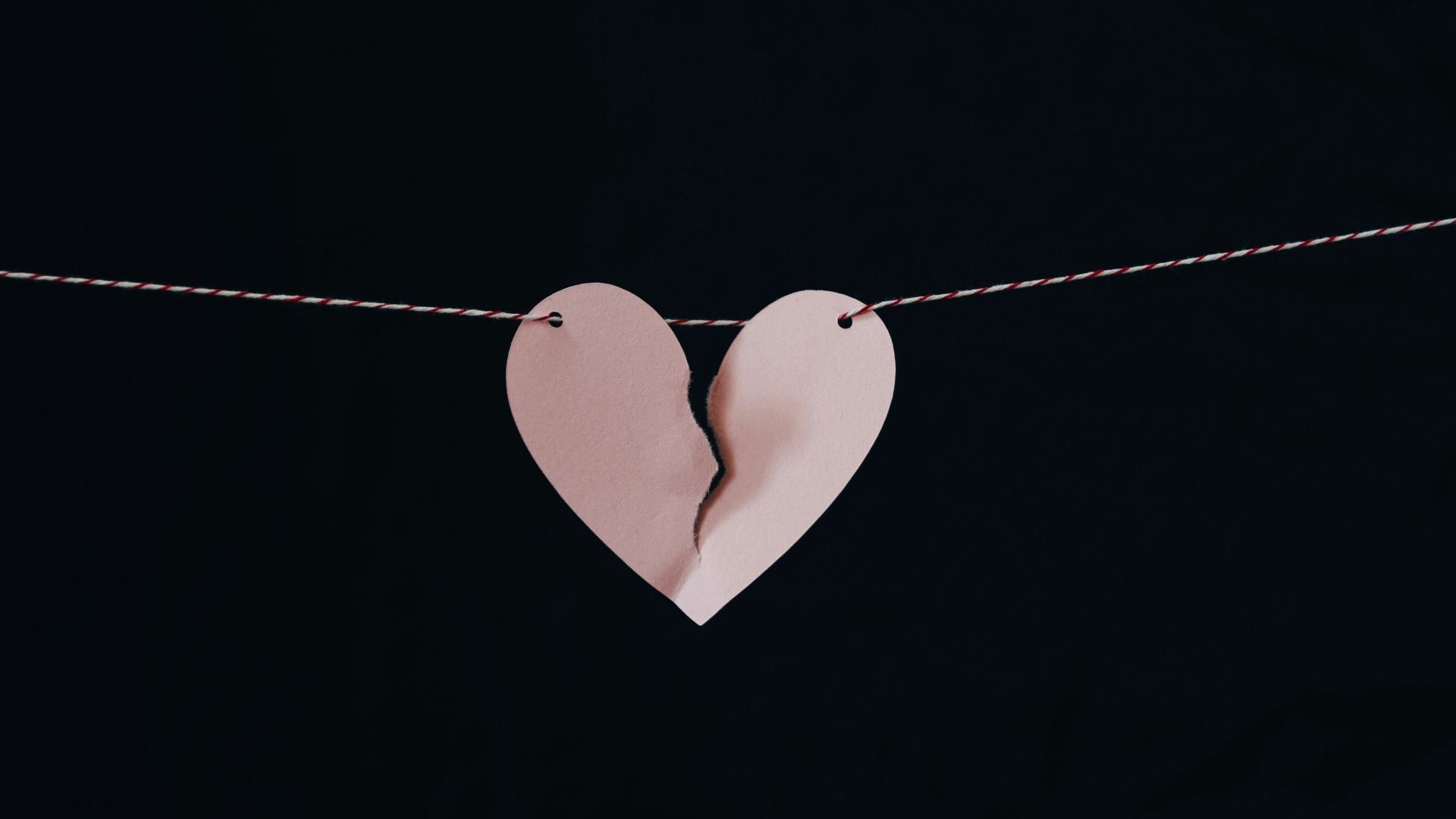 broken heart hanging on wire