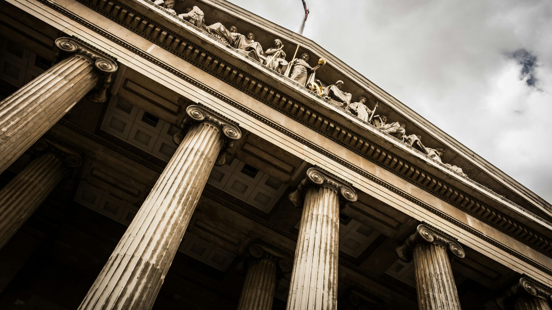 low angle photography of beige building