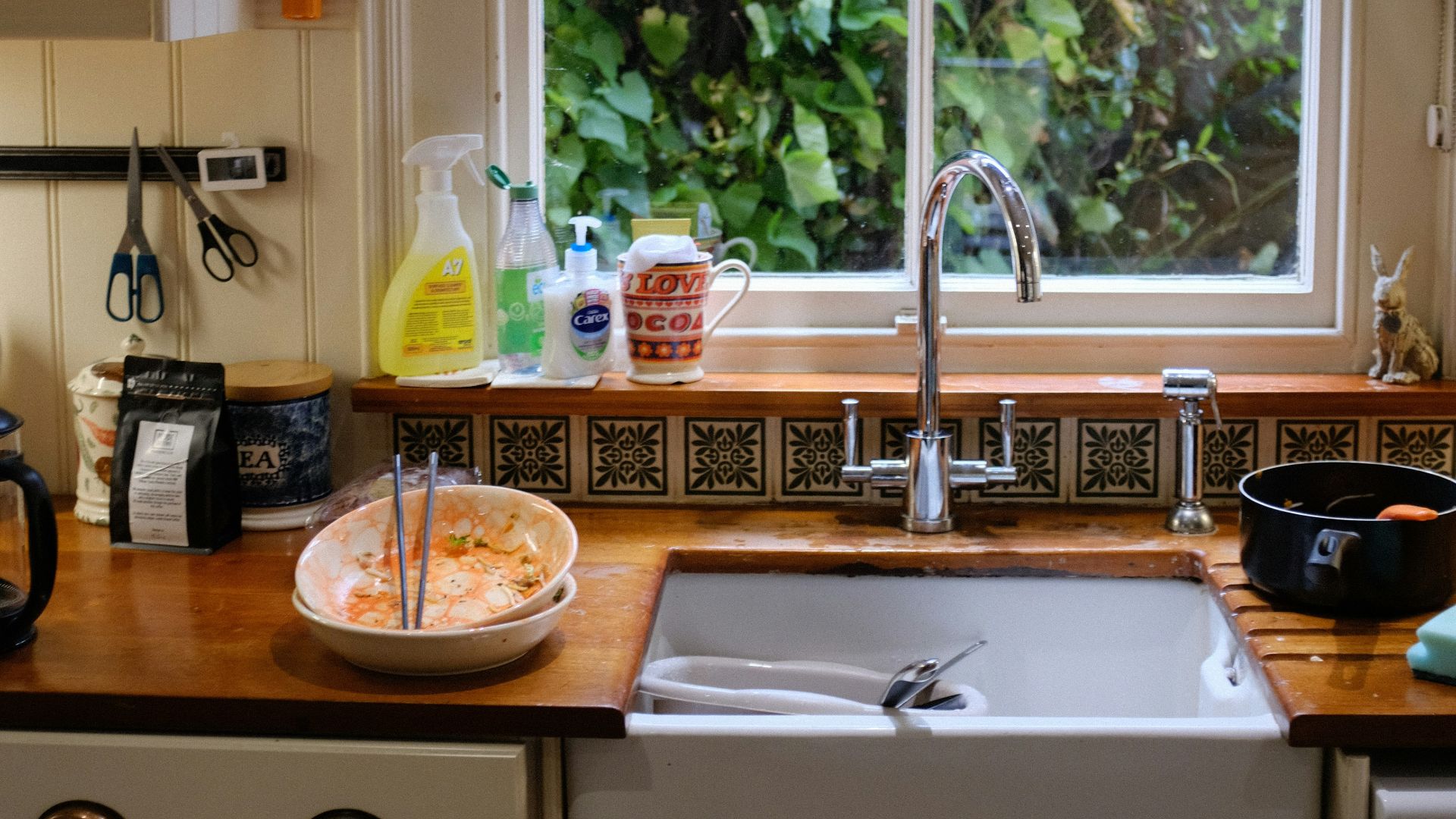 brown wooden round table with stainless steel faucet