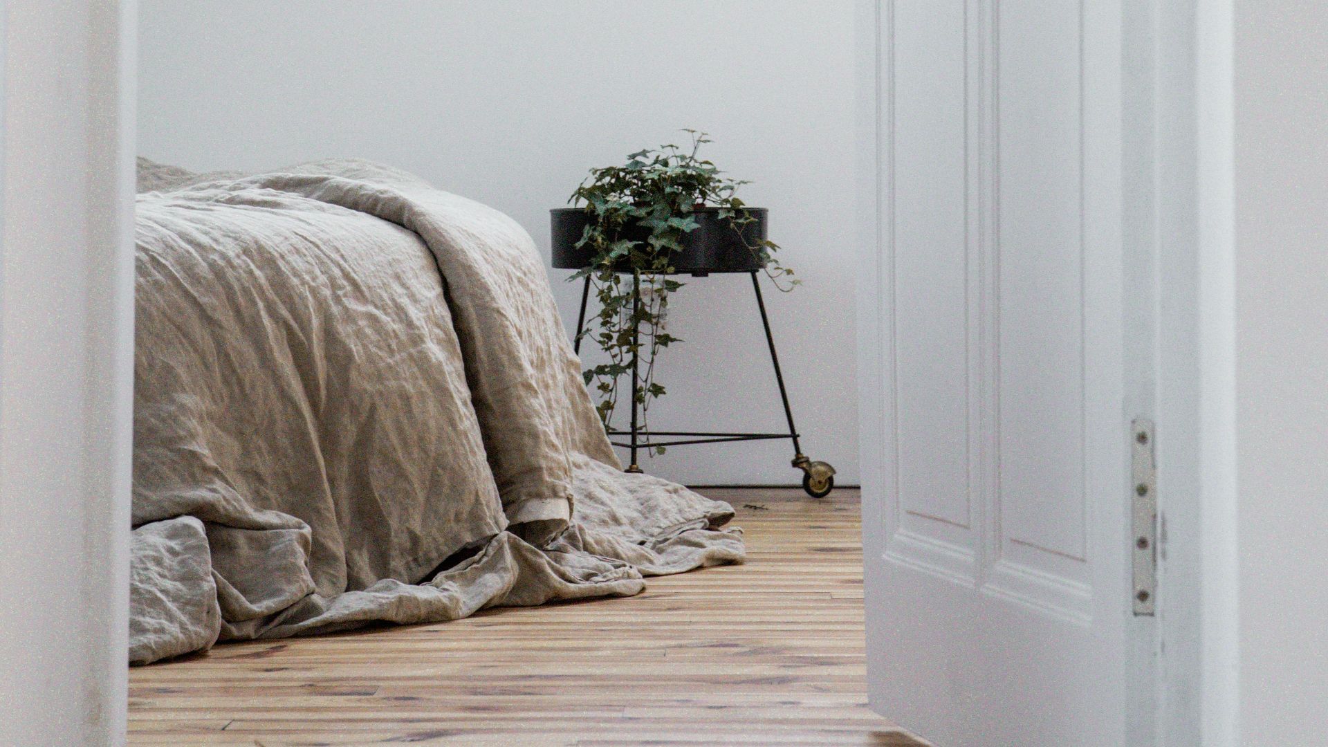 white bed linen on bed