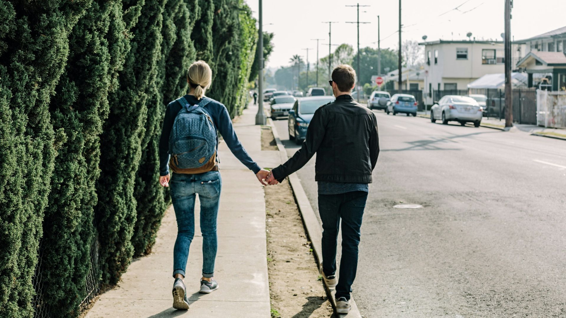 man and woman walking on pathway during daytime