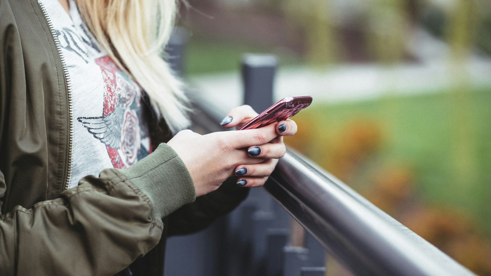 woman holding red phone