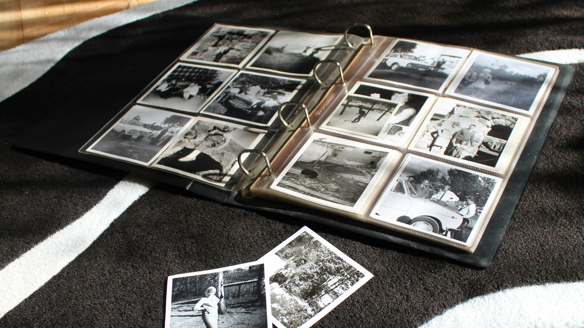 an open book laying on top of a zebra print blanket