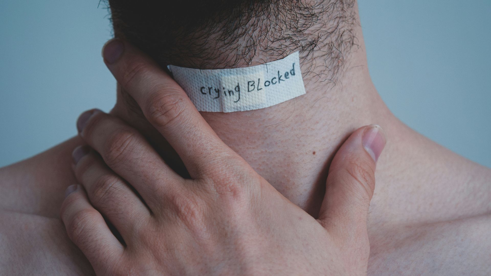 person with white paper on his head