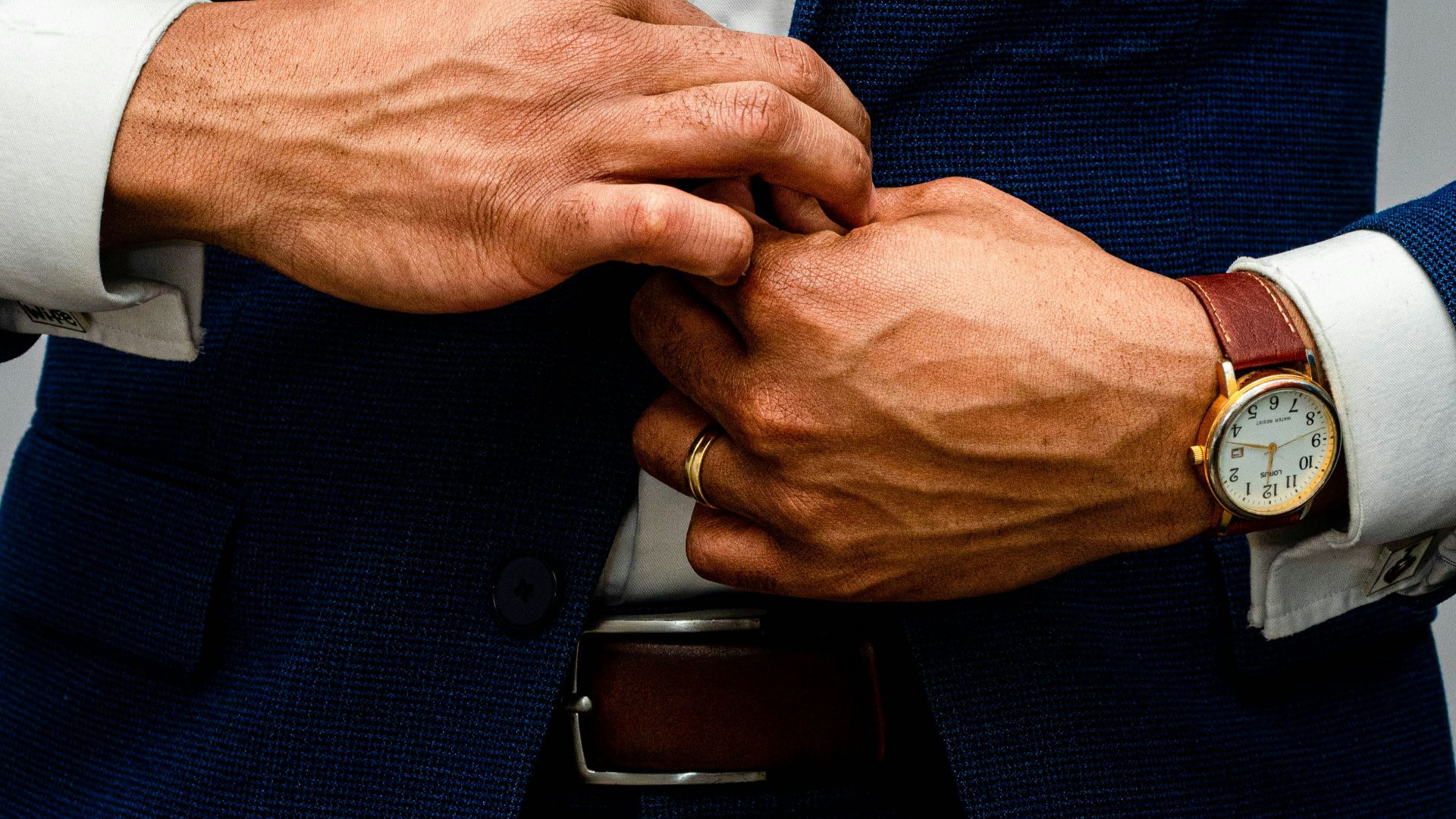 man in blue suit jacket and white dress shirt