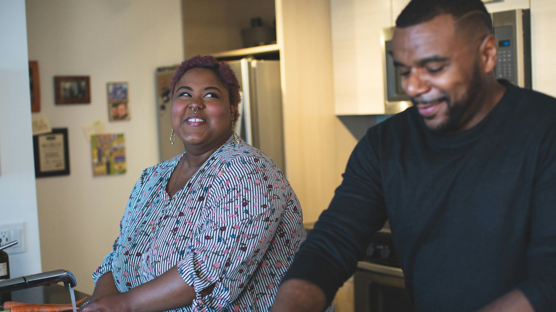man and woman standing near wall