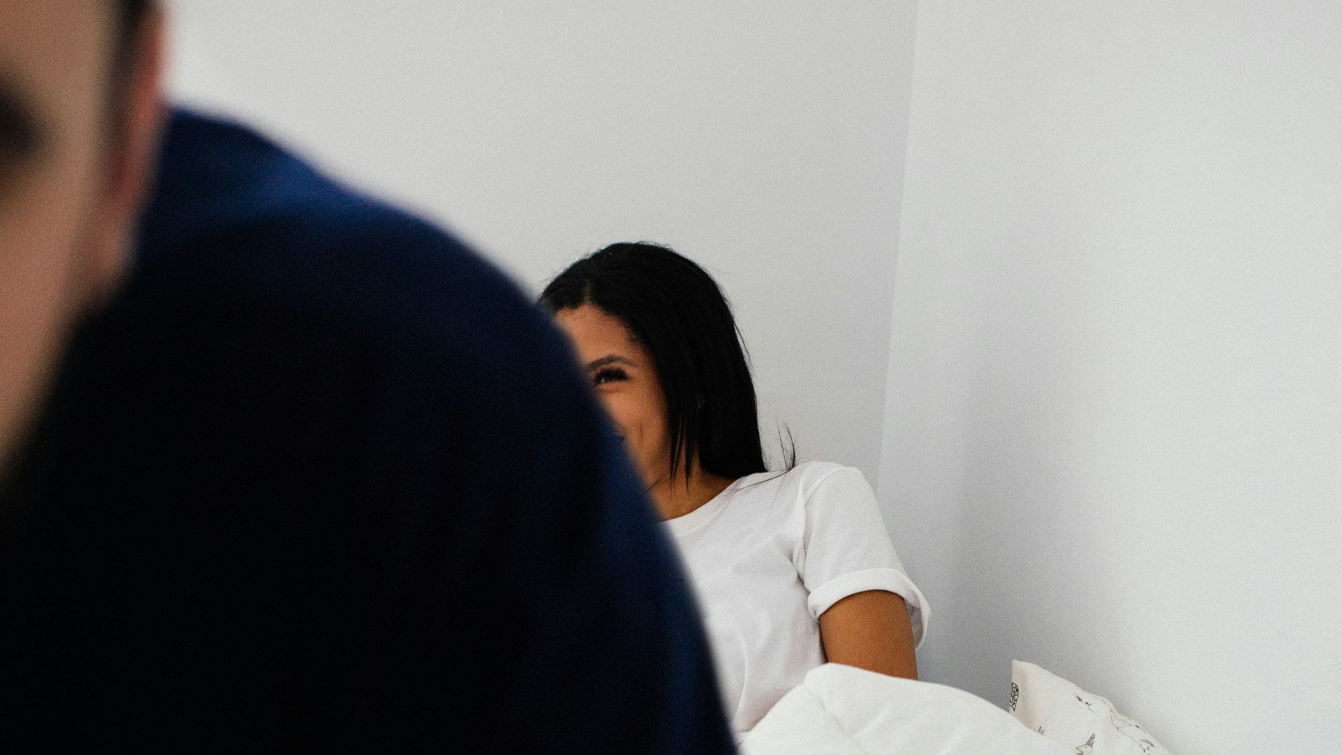 woman lying on bed in room