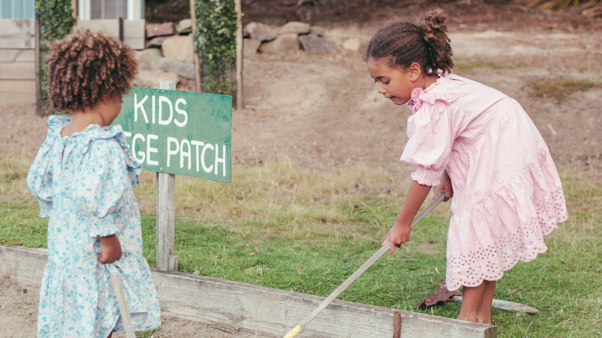 a couple of girls cleaning the ground