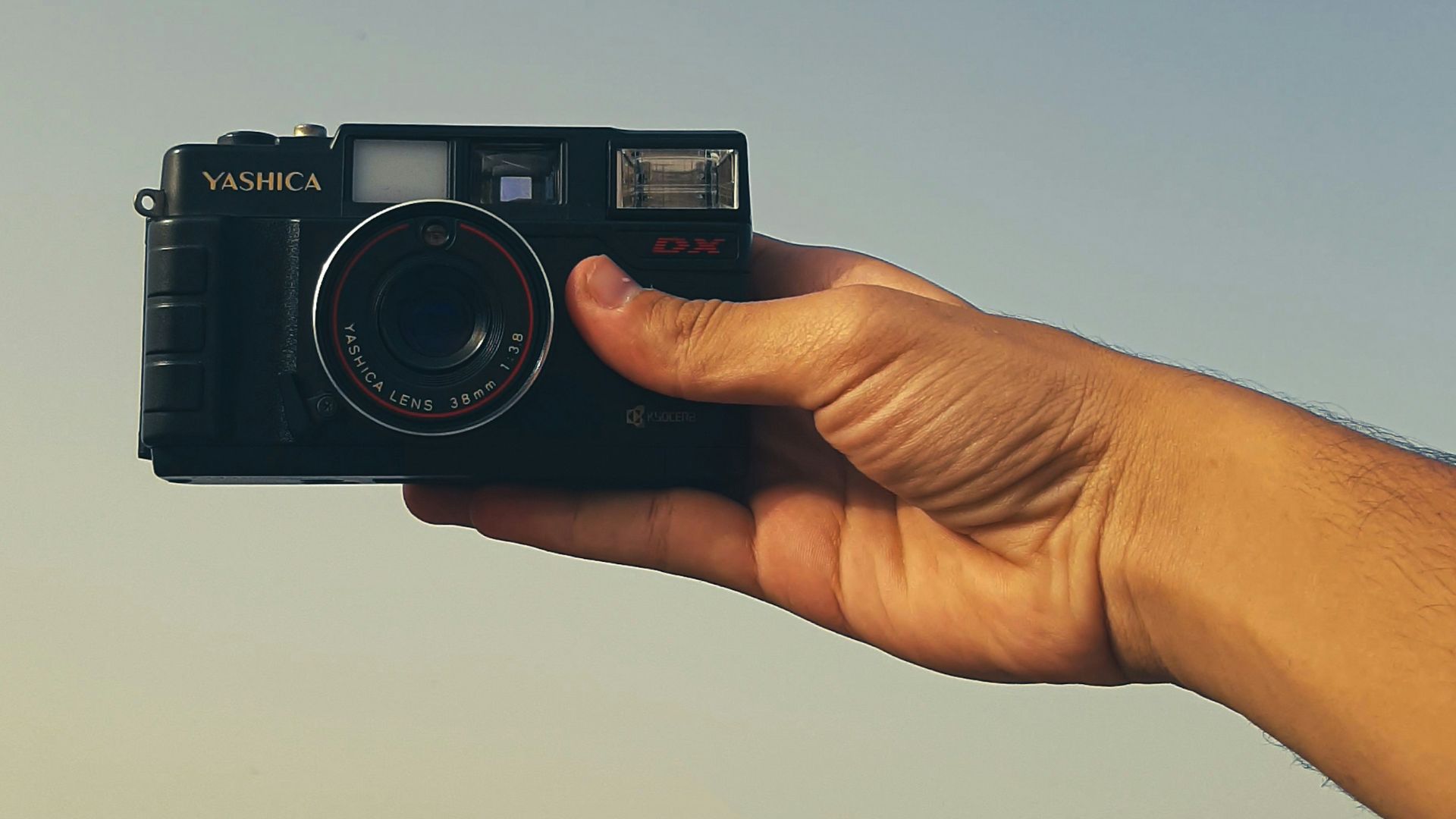 a person holding a camera in their hand