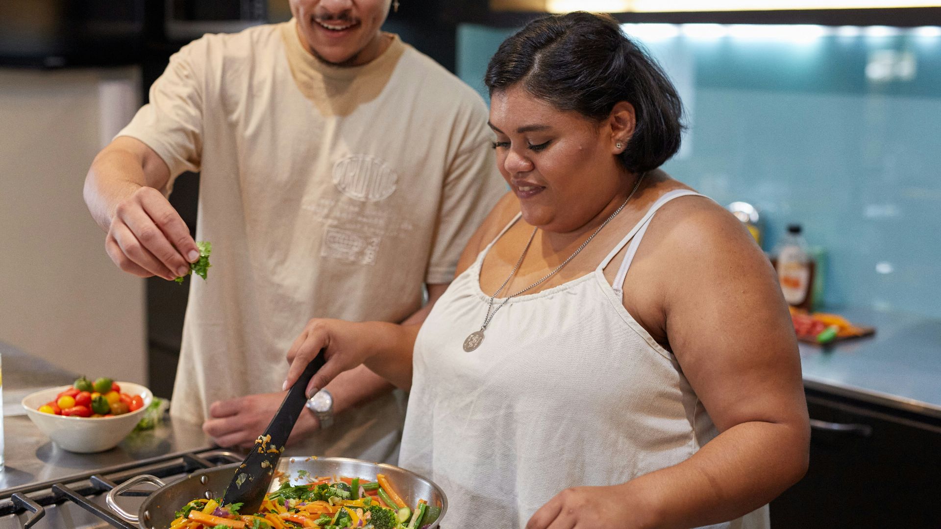 people preparing food in a kitchen